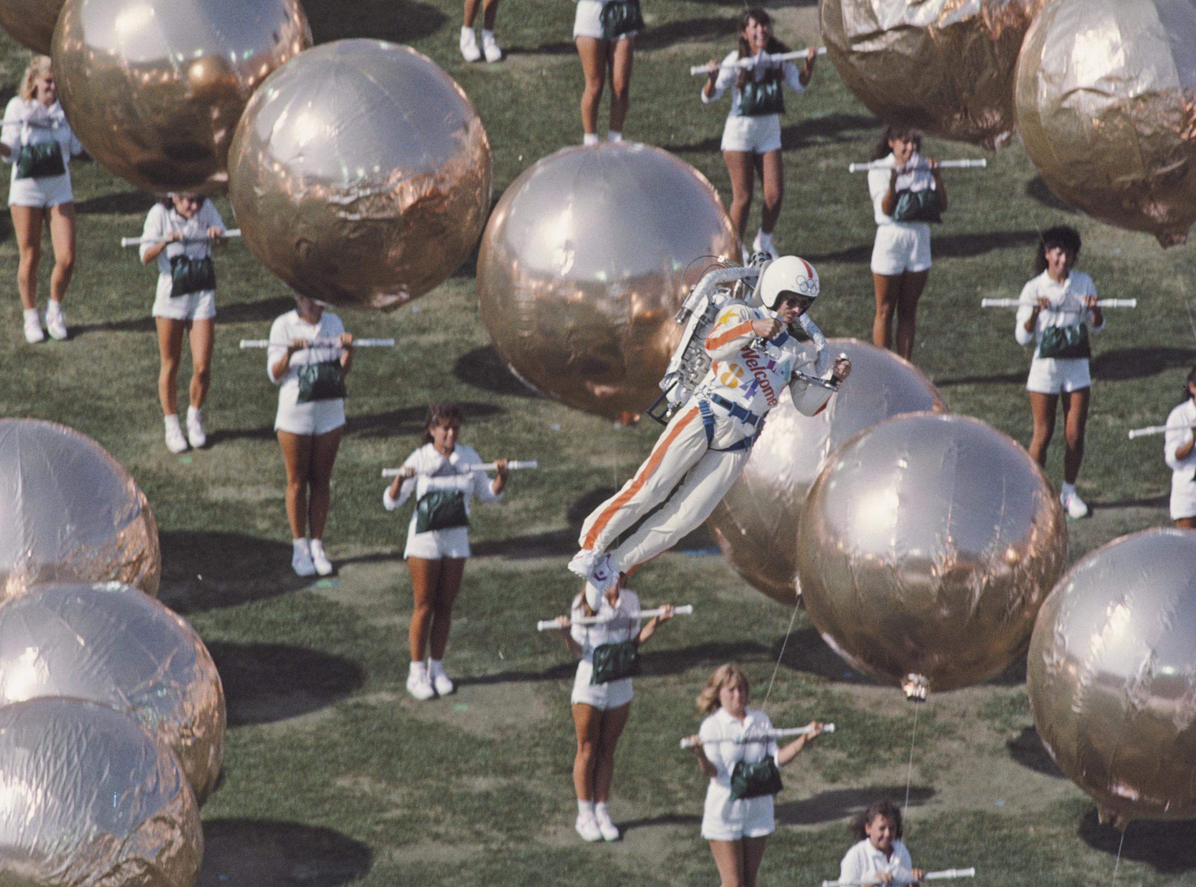 Los Angeles, 1984Bill Suitor hovers over the stadium by means of the Bell Aerosystems rocket pack.