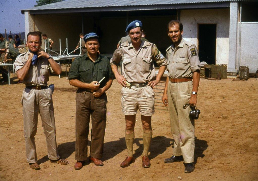Comdt. Pat Quinlan, second from right, with the Norwegian pilot Bjorne Hovden, left, and Swedish co-pilot, right, of a U.N. helicopter that landed in Jadotville under heavy fire during the battle, in an attempt to deliver water to Irish troops. A Company’s Swedish interpreter Lars Froberg is second from left.