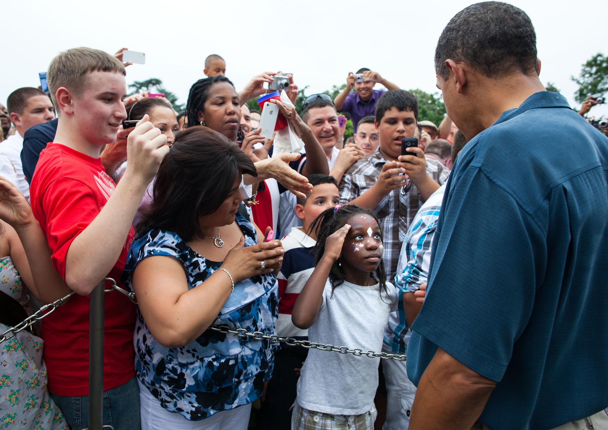 President Barack Obama and First Lady Michelle Obama welcome military families attending the Fourth of July celebration on the South Lawn of the White House, July 4, 2011. (Official White House Photo by Pete Souza)A young girl salutes President Barack Obama as he shakes hands along a ropeline with members of the military and their families during the Fourth of July celebration on the South Lawn of the White House, July 4, 2011. (Official White House Photo by Pete Souza)July 4, 2011"I'm always trying to capture how people react to the President especially when he works a rope line. On the Fourth of July, the President was greeting members of the military and their families on the South Lawn when a young girl struck a salute as the President approached."(Official White House Photo by Pete Souza)