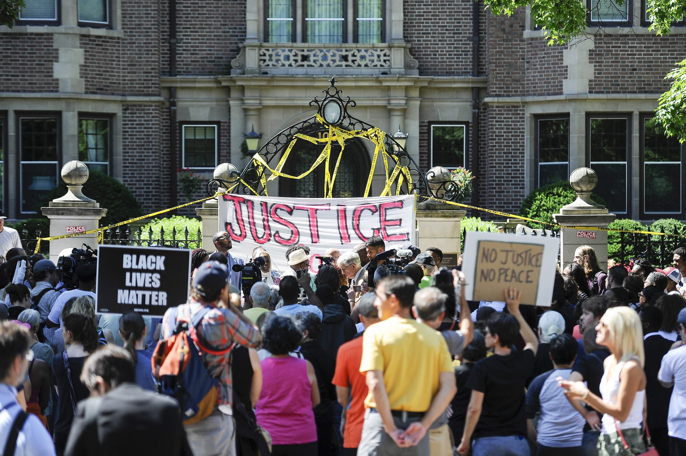 Protesters gather in front of the governor's residence in reaction to the the police shooting of Philando Castile in St. Paul, Minnesota, July 7, 2016.