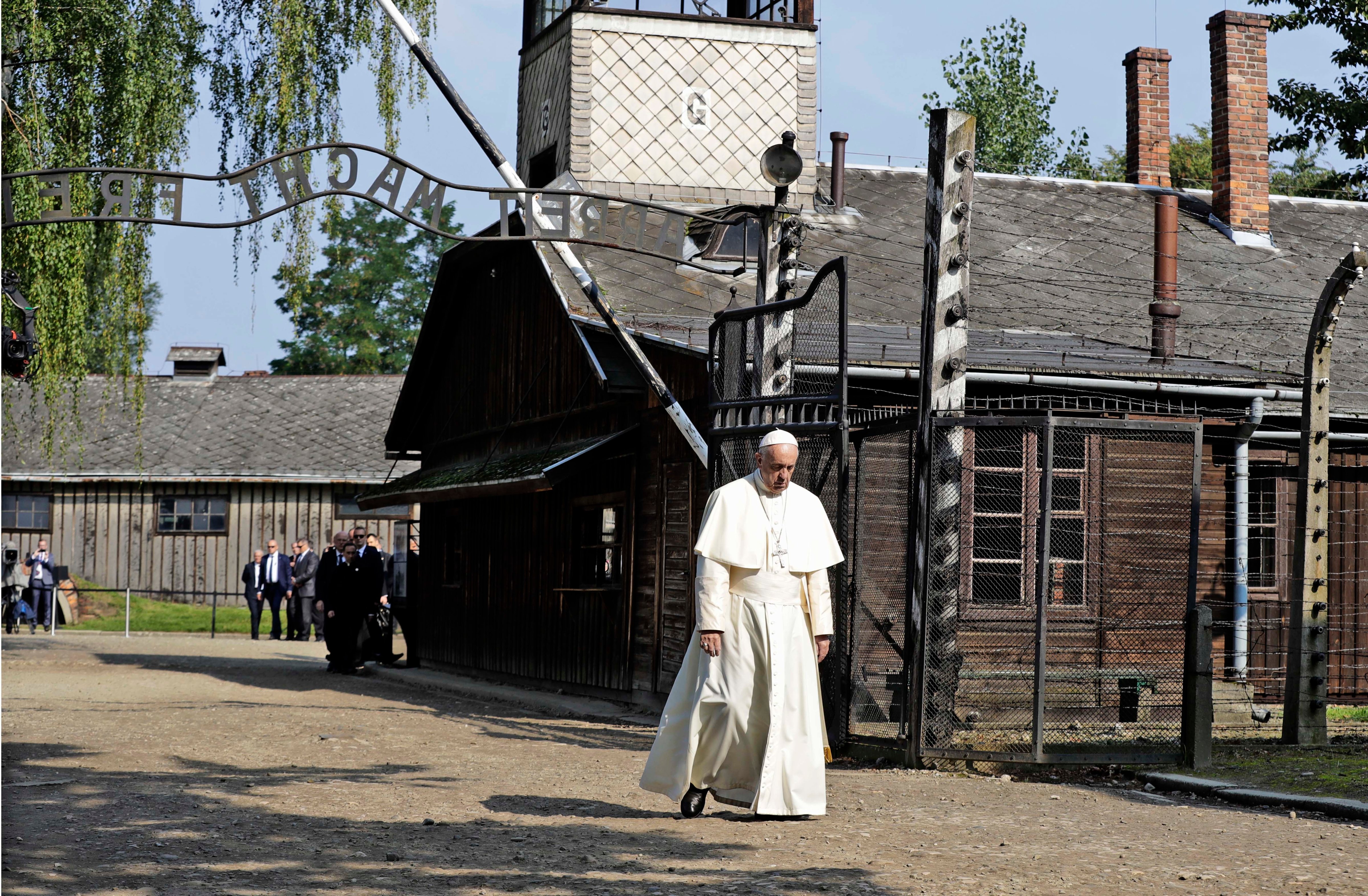 Pope Francis walks through the gate of the former Nazi German death camp of Auschwitz in Oswiecim, Poland on Friday, July 29, 2016. (Gregorio Borgia—AP)
