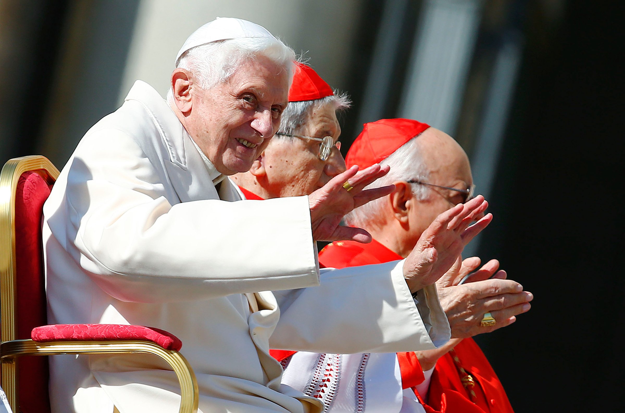 Emeritus Pope Benedict XVI waves before a mass in Saint Peter's square at the Vatican, Sept. 28, 2014.