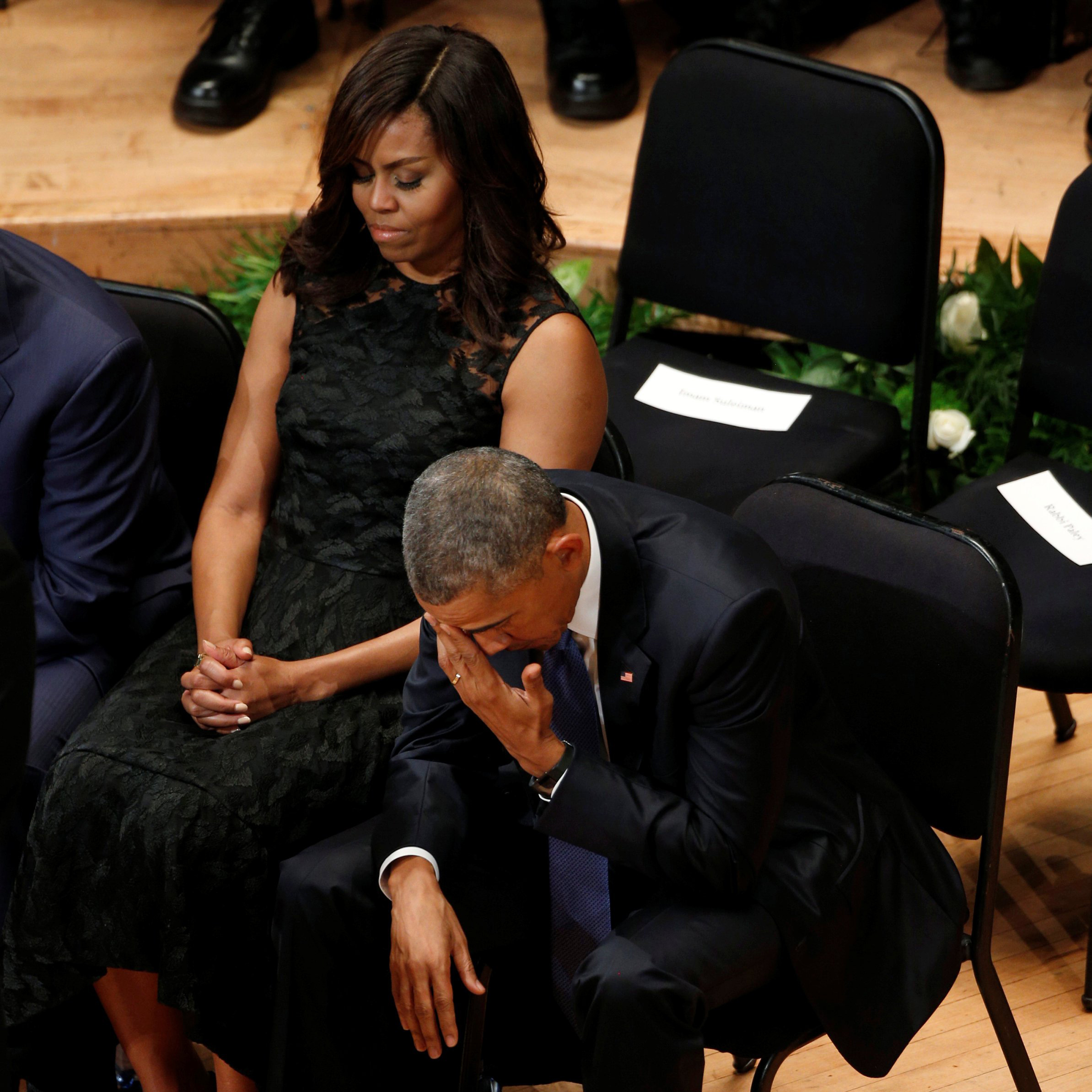 President Barack Obama and first lady Michelle Obama attend a memorial service on July 12, 2016 for five policemen killed last week in an attack in Dallas.