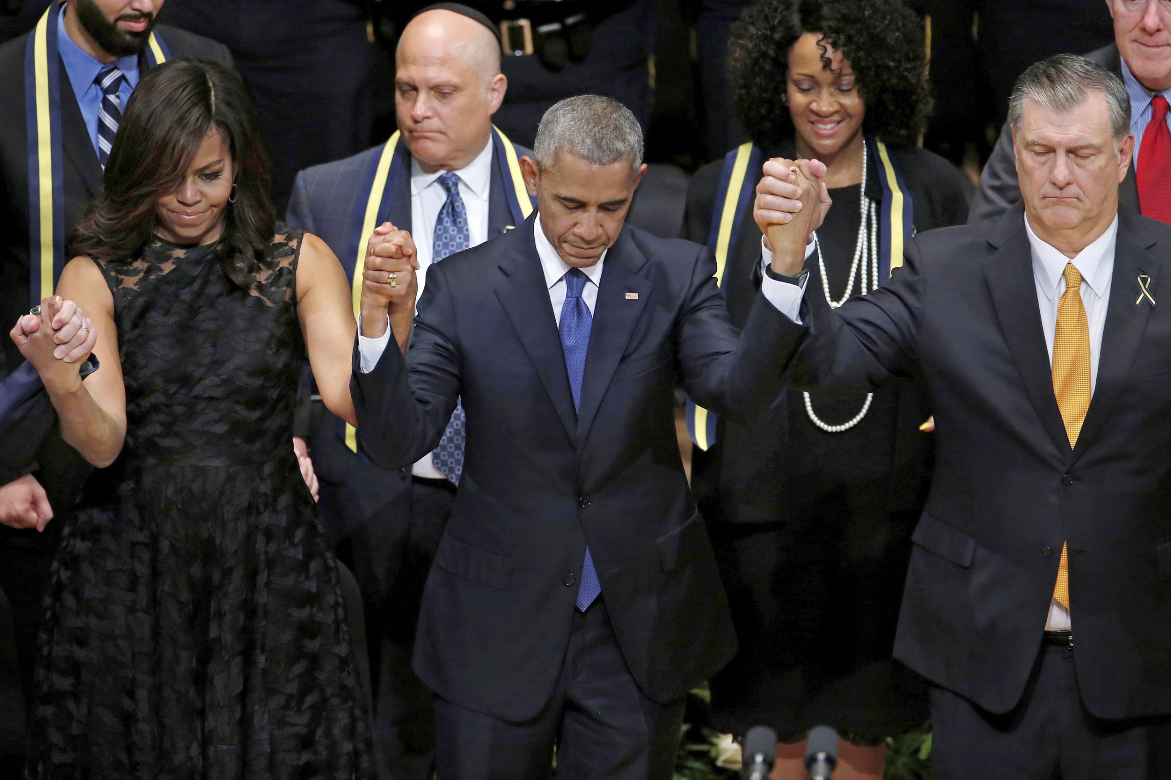 At a service for the five Dallas police officers killed on July 8, President Obama, with Michelle Obama and Dallas Mayor Mike Rawlings, said he had “spoken at too many memorials”