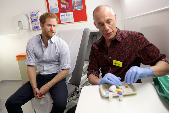 Prince Harry waits for the results of an HIV test taken by Specialist Psychotherapist Robert Palmer as visits Burrell Street Sexual Health Clinic on July 14, 2016 in London, England.