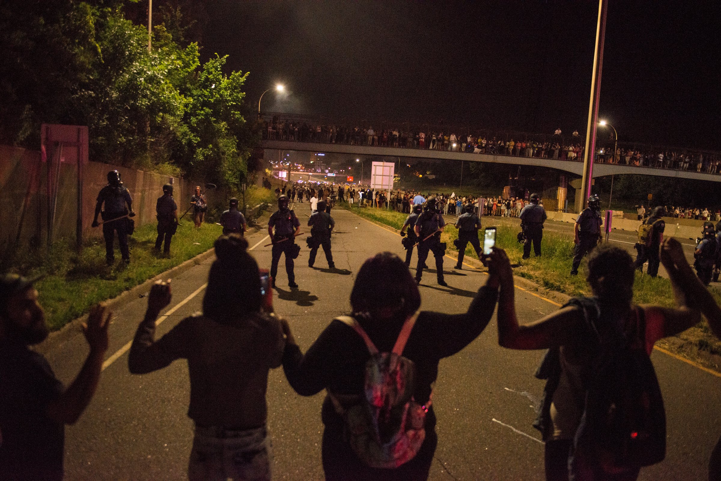 Protesters link hands on shut down highway I-94 on July 9, 2016 in St. Paul, Minnesota, in response to the police killing of Philando Castile on June 6, 2016 in Falcon Heights, Minnesota