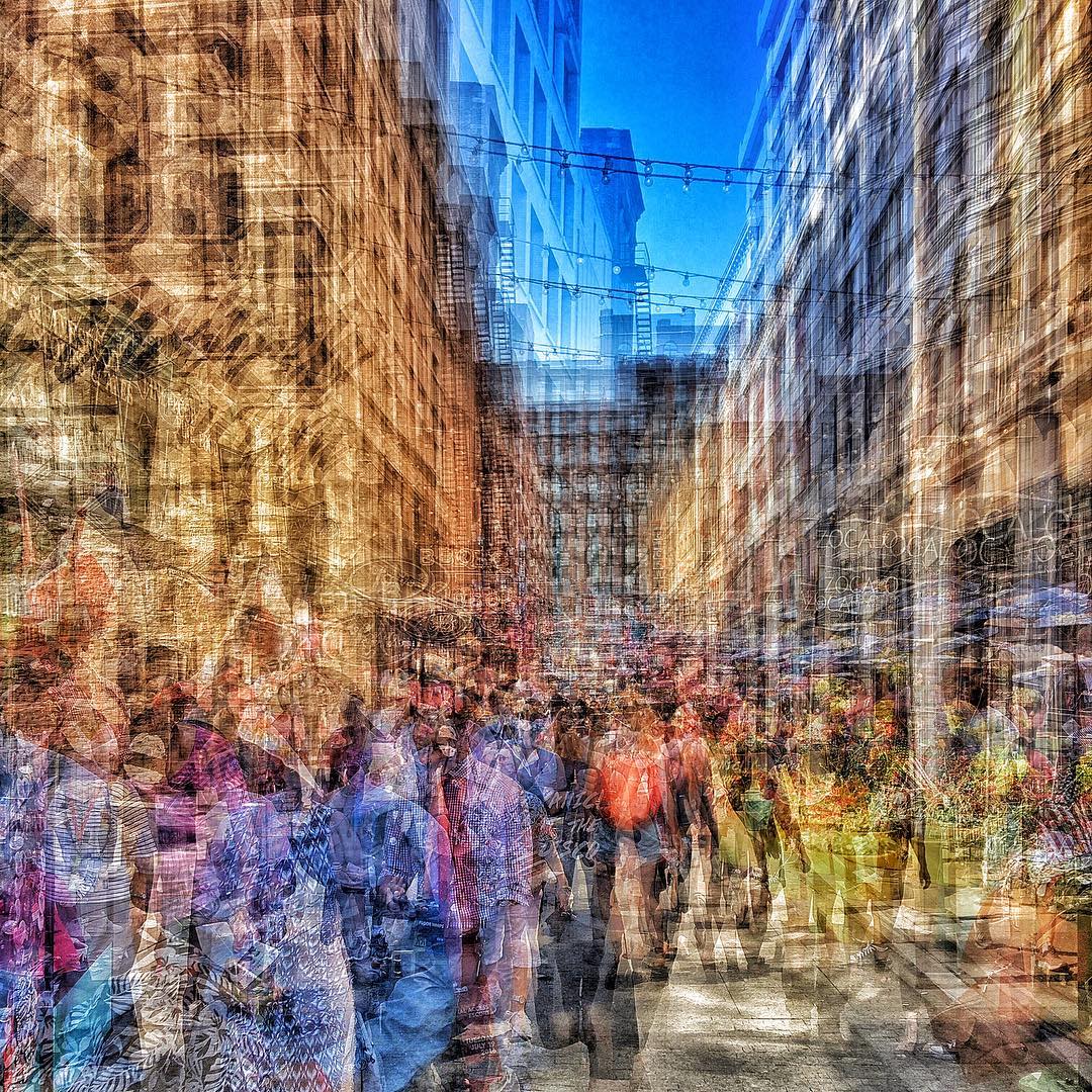 This multiple-exposure photograph was created by Ben Lowy (@benlowy) as he walked from the East 4th Street Entrance to the Quicken Loans Arena used by delegates, journalists, and convention workers. The street is swamped with merchandisers selling convention memorabilia. Cleveland, July 20, 2016.