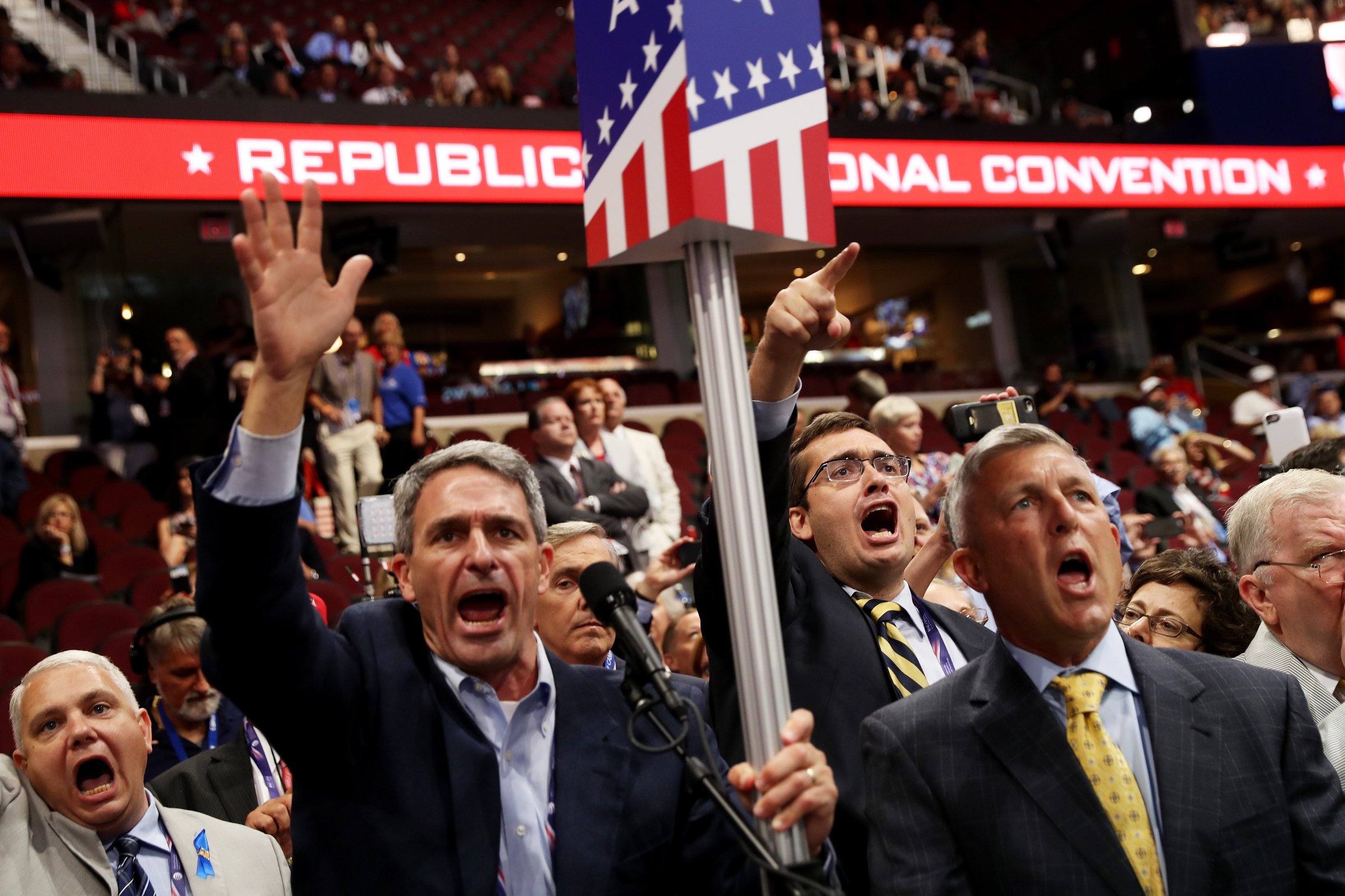 Former Virginia Attorney General Ken Cuccinelli, second left, along with other delegates from Virginia chant for a rule call vote on the first day of the Republican National Convention on July 18, 2016 at the Quicken Loans Arena in Cleveland.