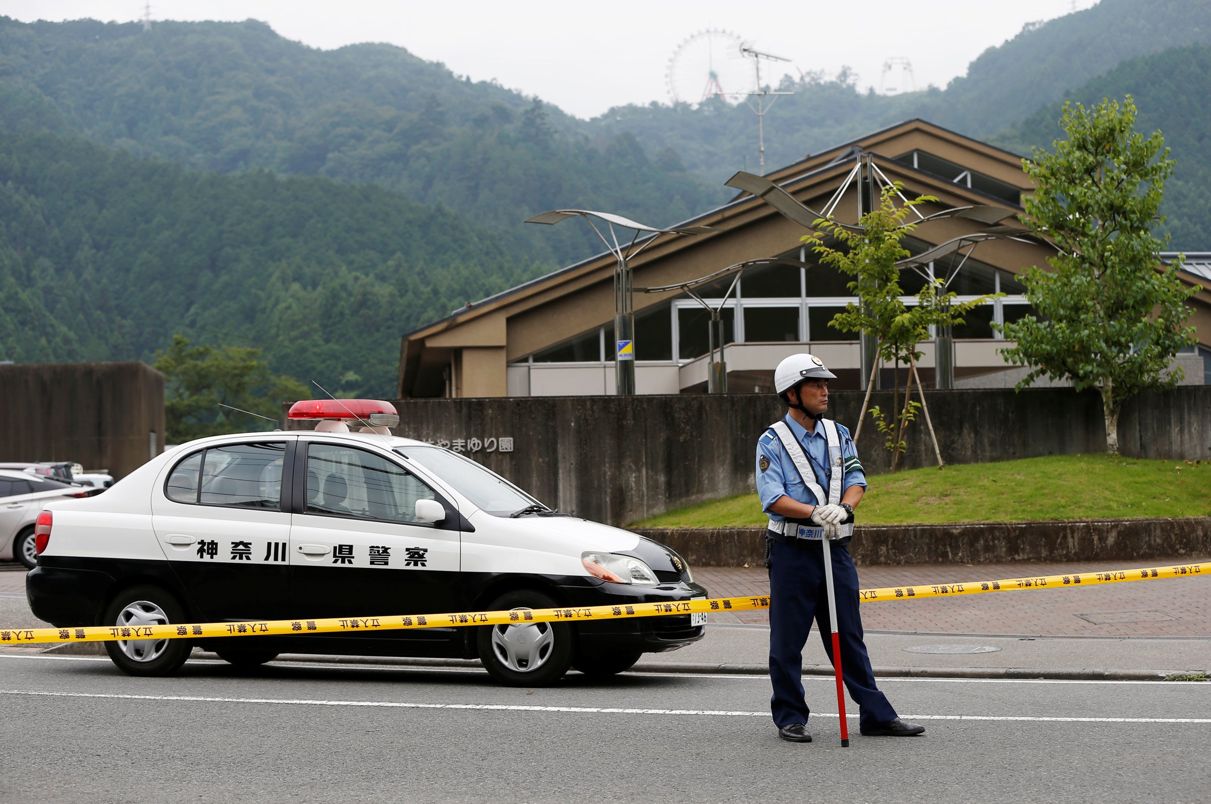 A police officer stands guard in front of a facility for the disabled, where a deadly attack by a knife-wielding man took place, in Sagamihara, Japan