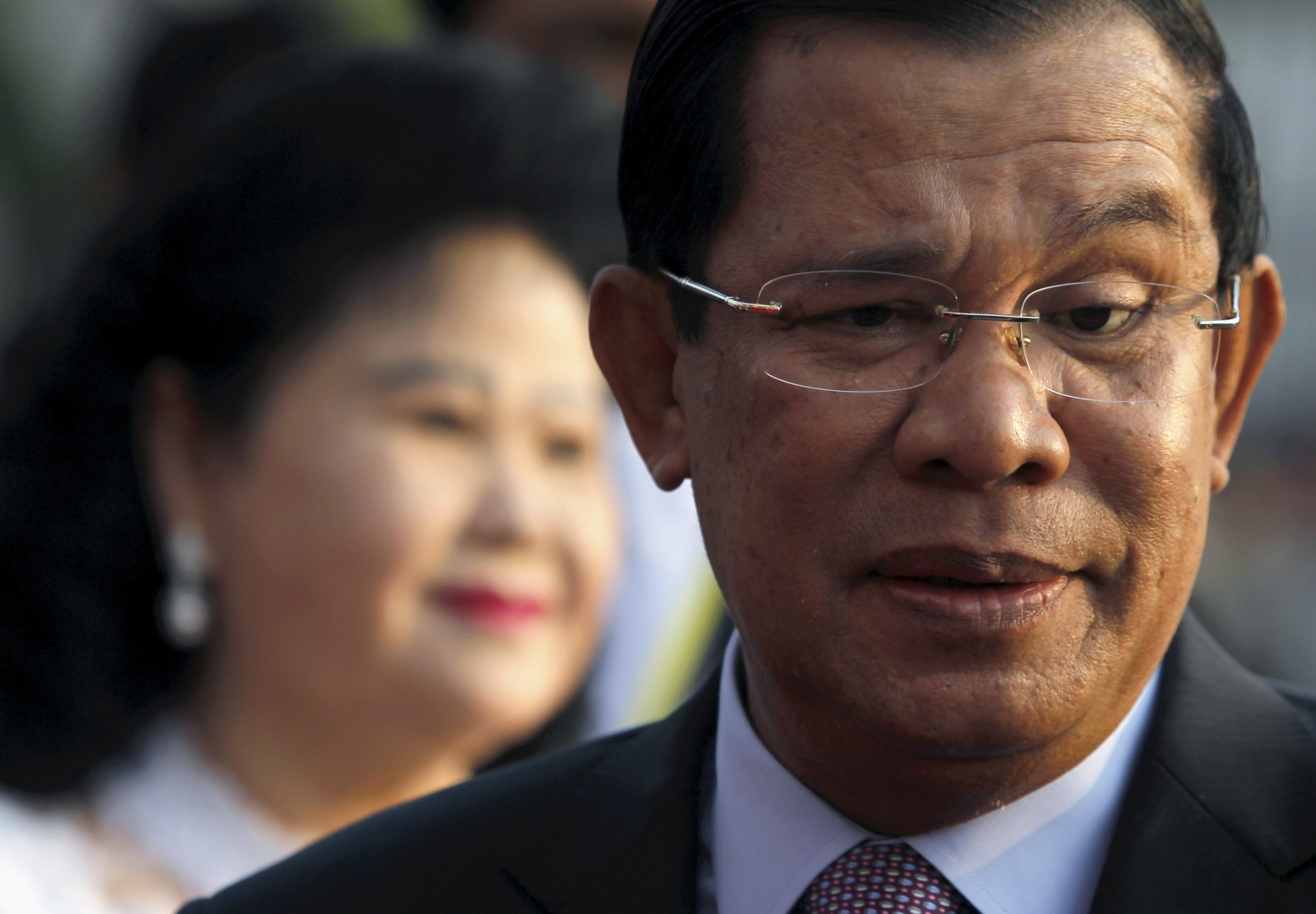 Hun Sen and his wife smile during a ceremony in Phnom Penh