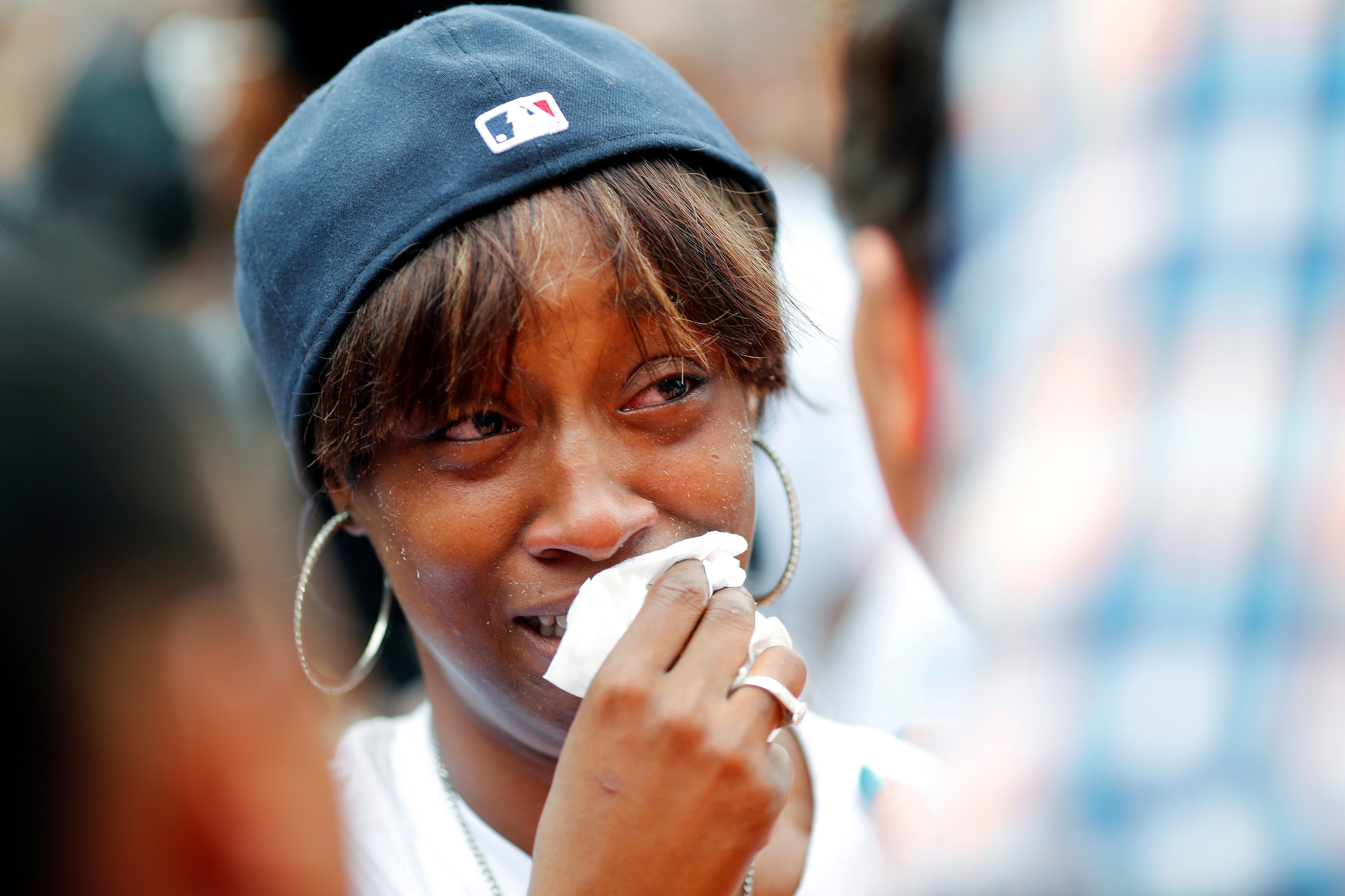 Diamond Reynolds, girlfriend of Philando Castile gets a hug as people gather to protest the fatal shooting of Philando Castile by Minneapolis area police in St. Paul