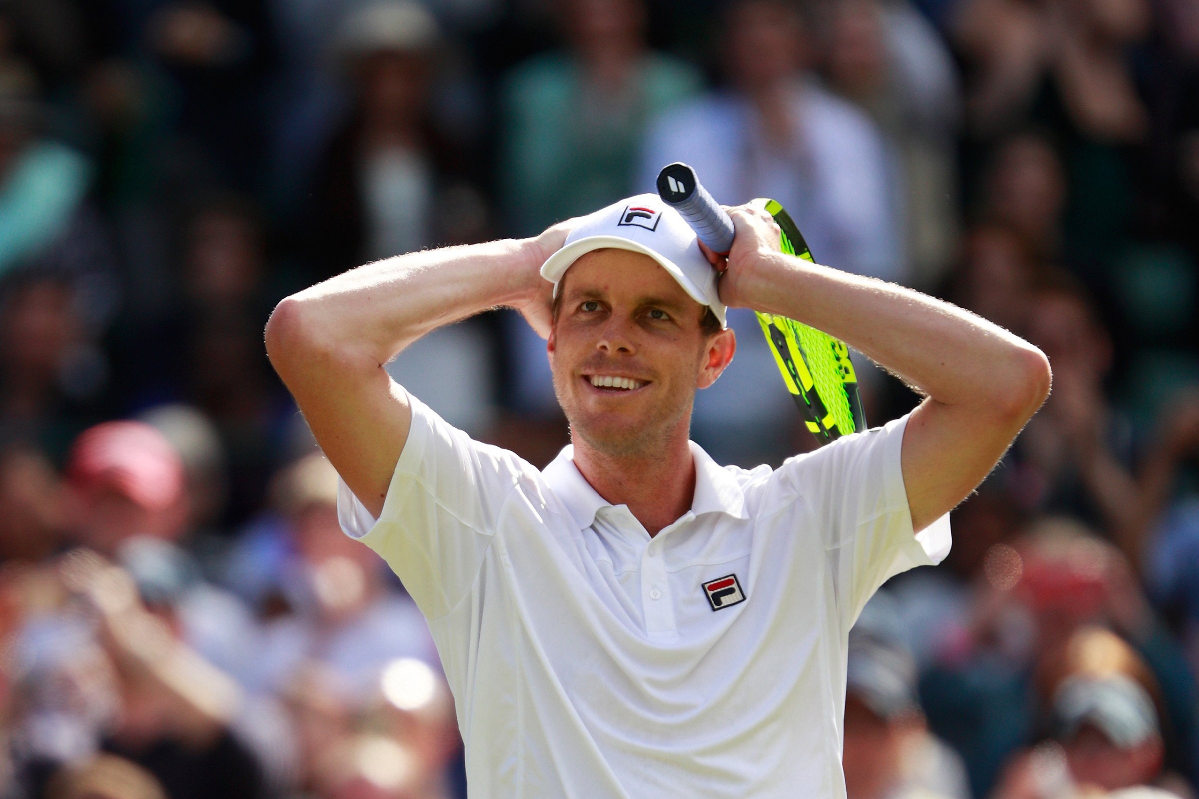Sam Querrey of the United States celebrates victory during the Men's Singles third round match against Novak Djokovic of Serbia on day six of the Wimbledon Lawn Tennis Championships in London on July 2, 2016.