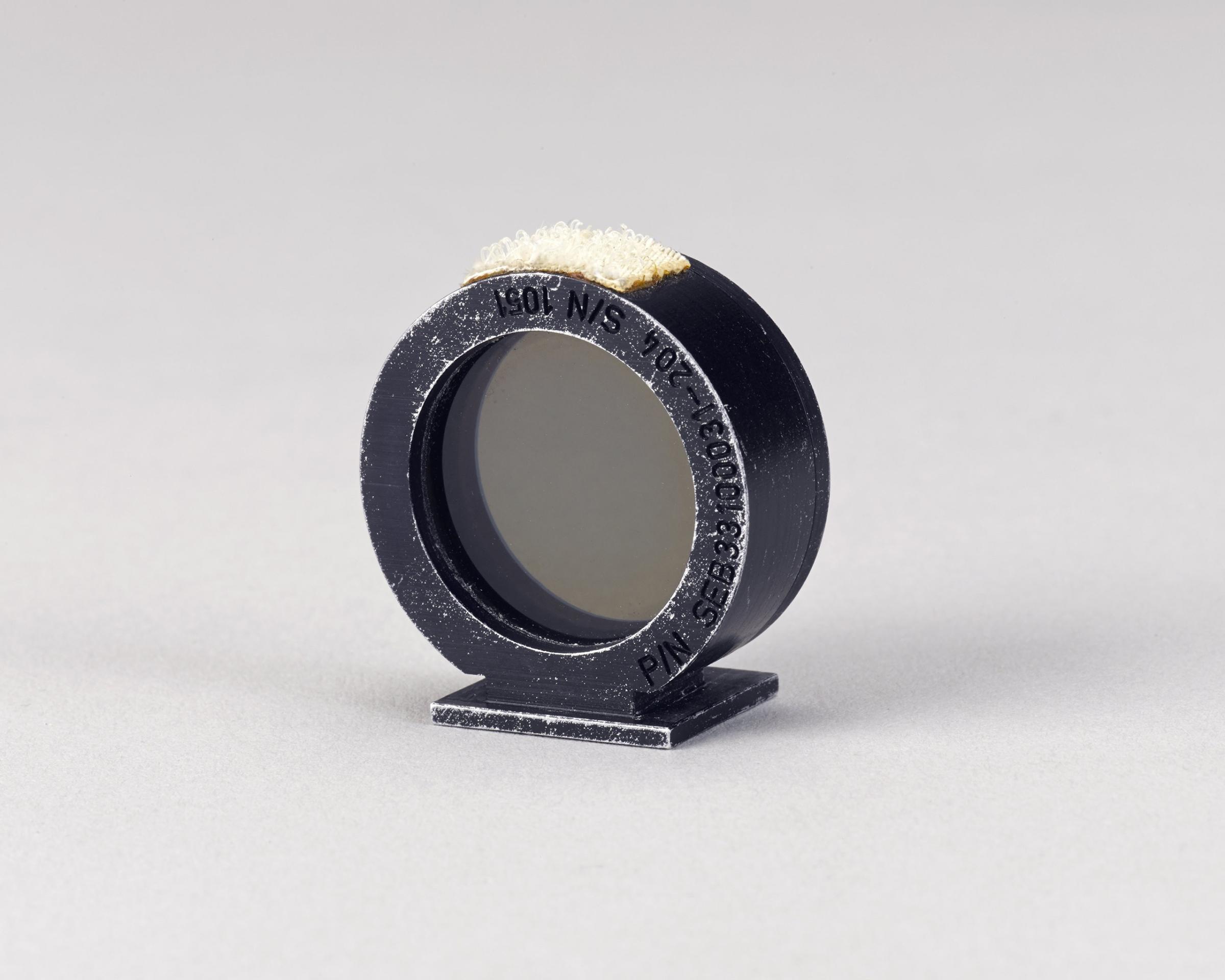 Motion picture ring sight used on the Moon during Apollo 15. This camera accessory was used by astronaut James B, Irwin on the 16mm camera inside the lunar module in 1971. It was on the lunar surface for 66 hours.