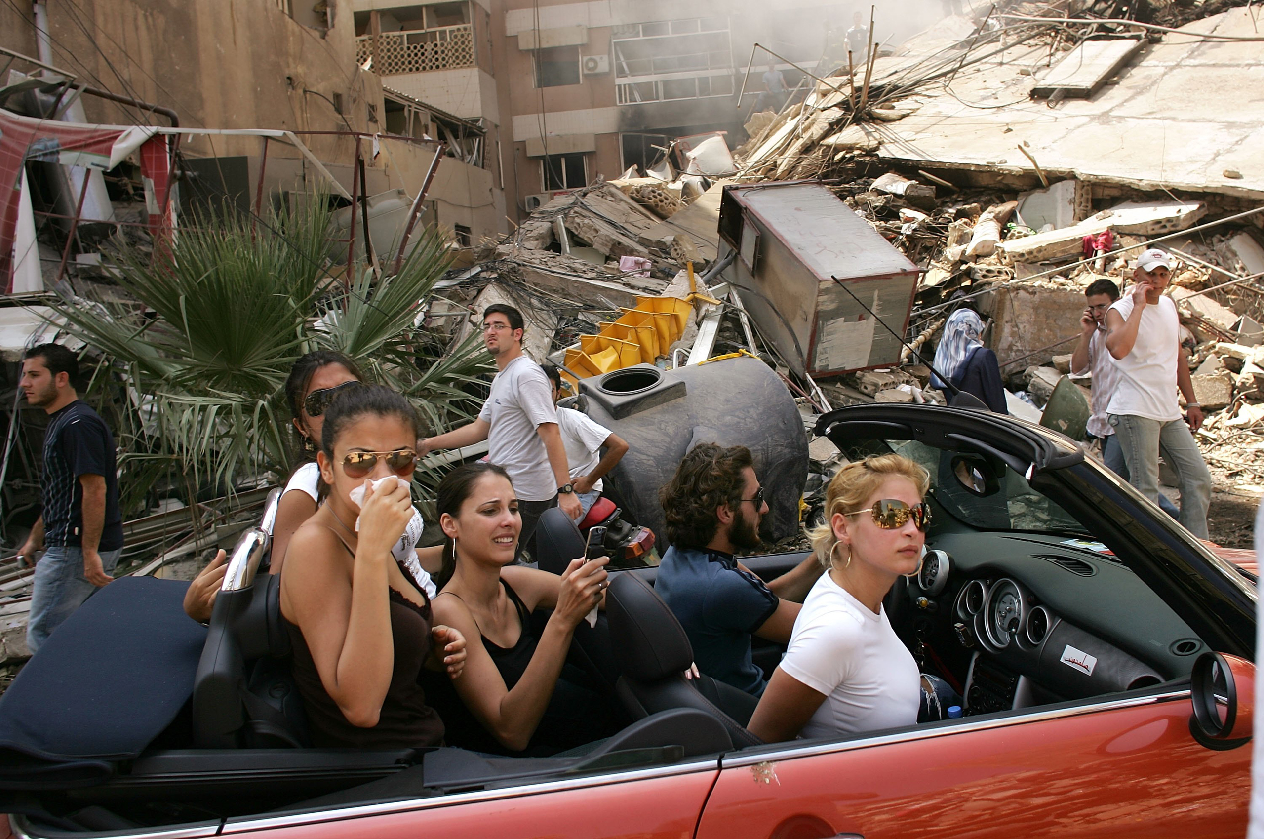 Like all images of conflict, I have mixed feelings about this picture I took in south Beirut in 2006. I see it every morning framed on a stark white wall in my Brooklyn apartment. The opaque nature of reality in the Middle East is captured in the image. The beautiful subjects in the red Mini Cooper driving through a devastated neighborhood took offense at how they were depicted. They falsely claimed to reporters that they were actually refugees. The way I was subsequently treated by numerous members of the media made me want to leave the profession and go someplace far away. For me, this picture also stirs feelings of hopelessness for the region. War has developed a vicious tenacity in the Middle East. It seems to only get bloodier and darker with each passing year. News pictures are a hostage to time and place, liberating them from the fallout of what happens in the days and months after the click of the shutter. (Spencer Platt—Getty Images)