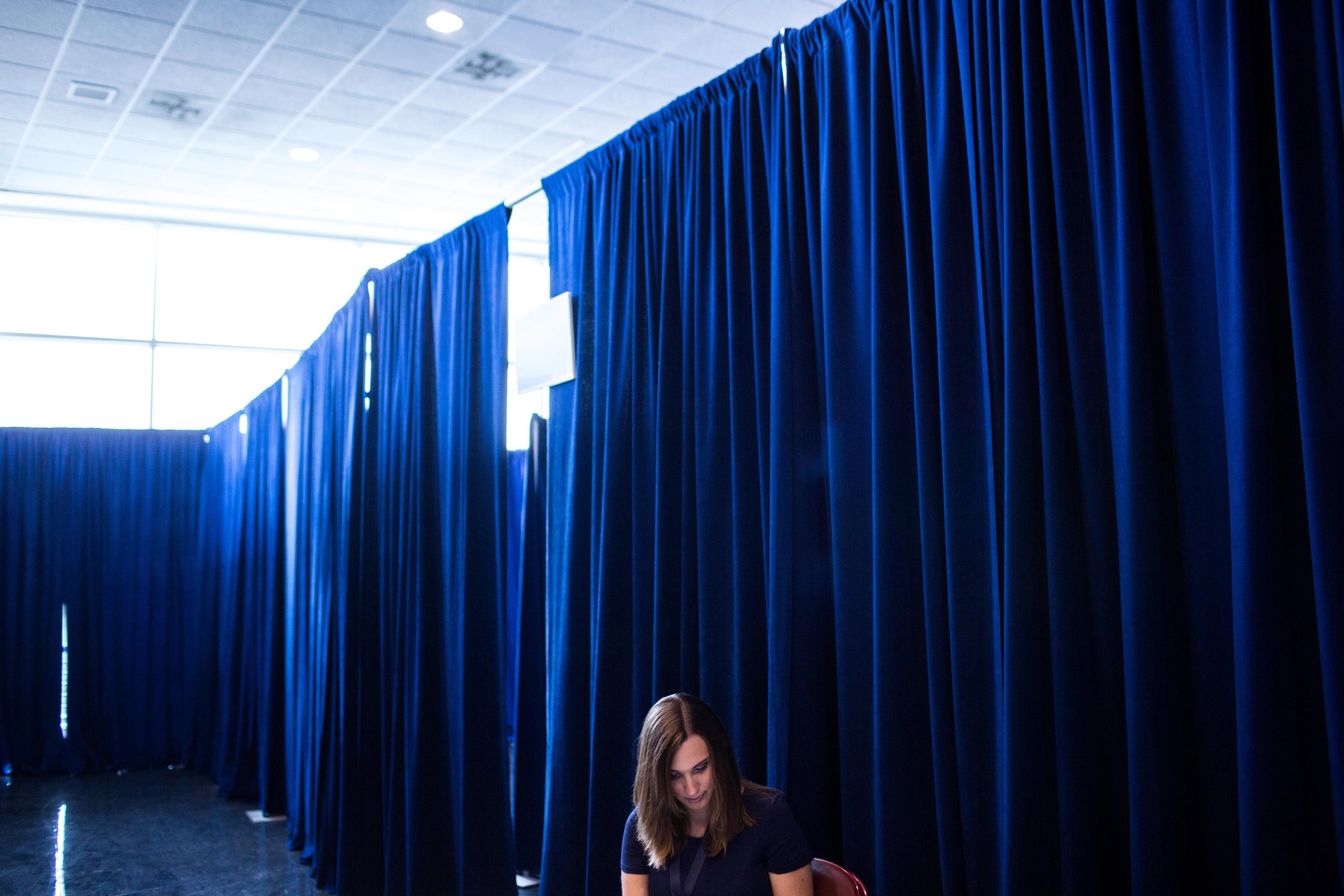 Sarah McBride sets up press meetings on her phone at the Wells Fargo Center where she is attending Democratic National Convention on July 25, 2016 in Philadelphia.(Natalie Keyssar for TIME)