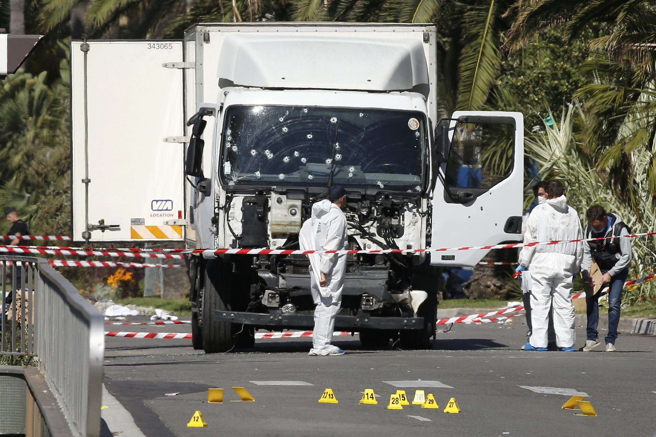 Investigators continue to work at the scene near the truck that was driven into a crowd at high speed, killing scores who were celebrating Bastille Day on July 14, on the Promenade des Anglais in Nice, France, on July 15, 2016. (Eric Gaillard—Reuters)