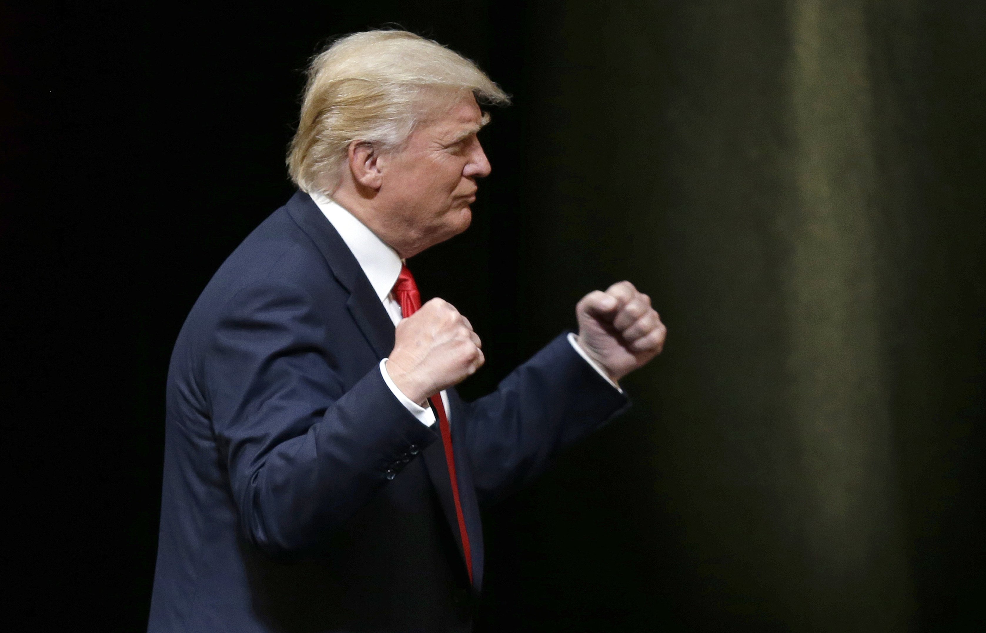 Donald Trump pumps his fists during a rally in Raleigh, N.C., on July 5, 2016. (Gerry Broome&mdash;AP)
