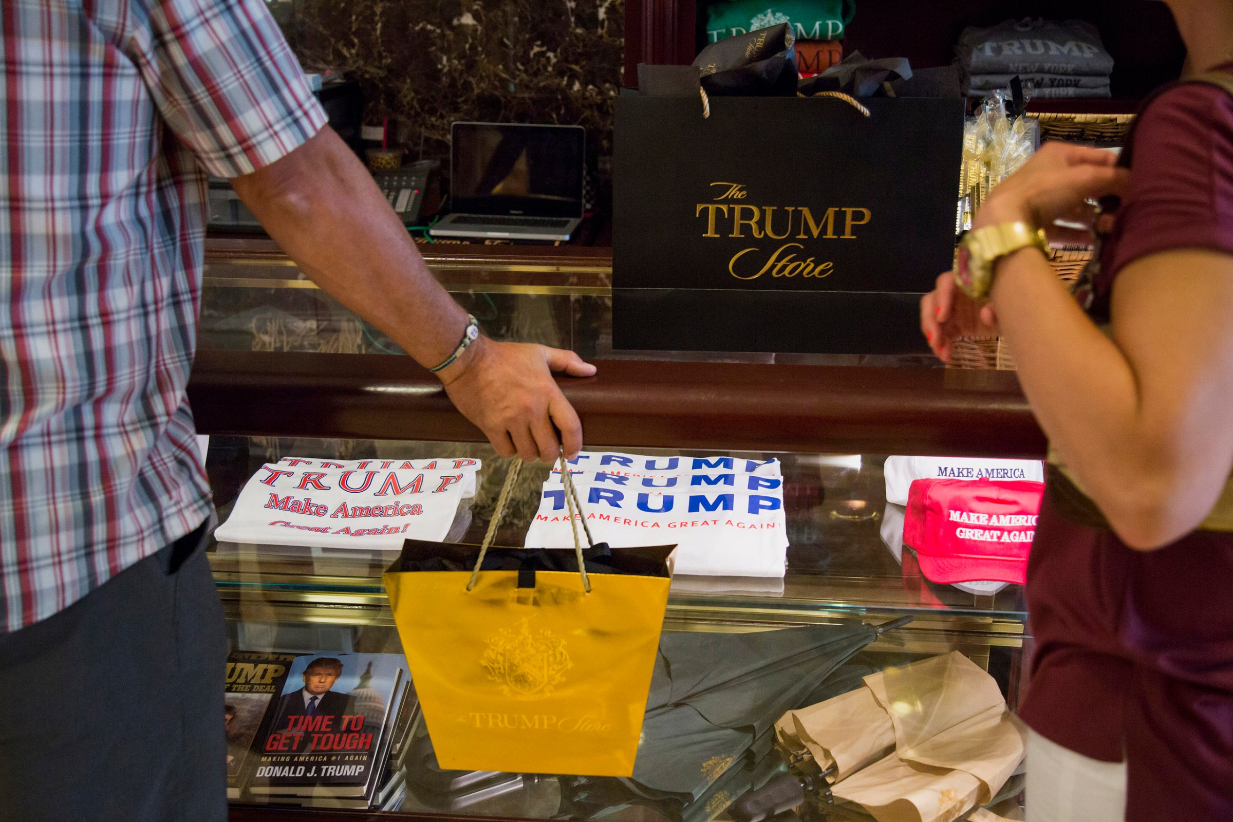 Shoppers purchase merchandise supporting Donald Trump, president and chief executive of Trump Organization Inc. and 2016 Republican presidential candidate, inside a store at Trump Tower in New York City on Aug. 26, 2015.