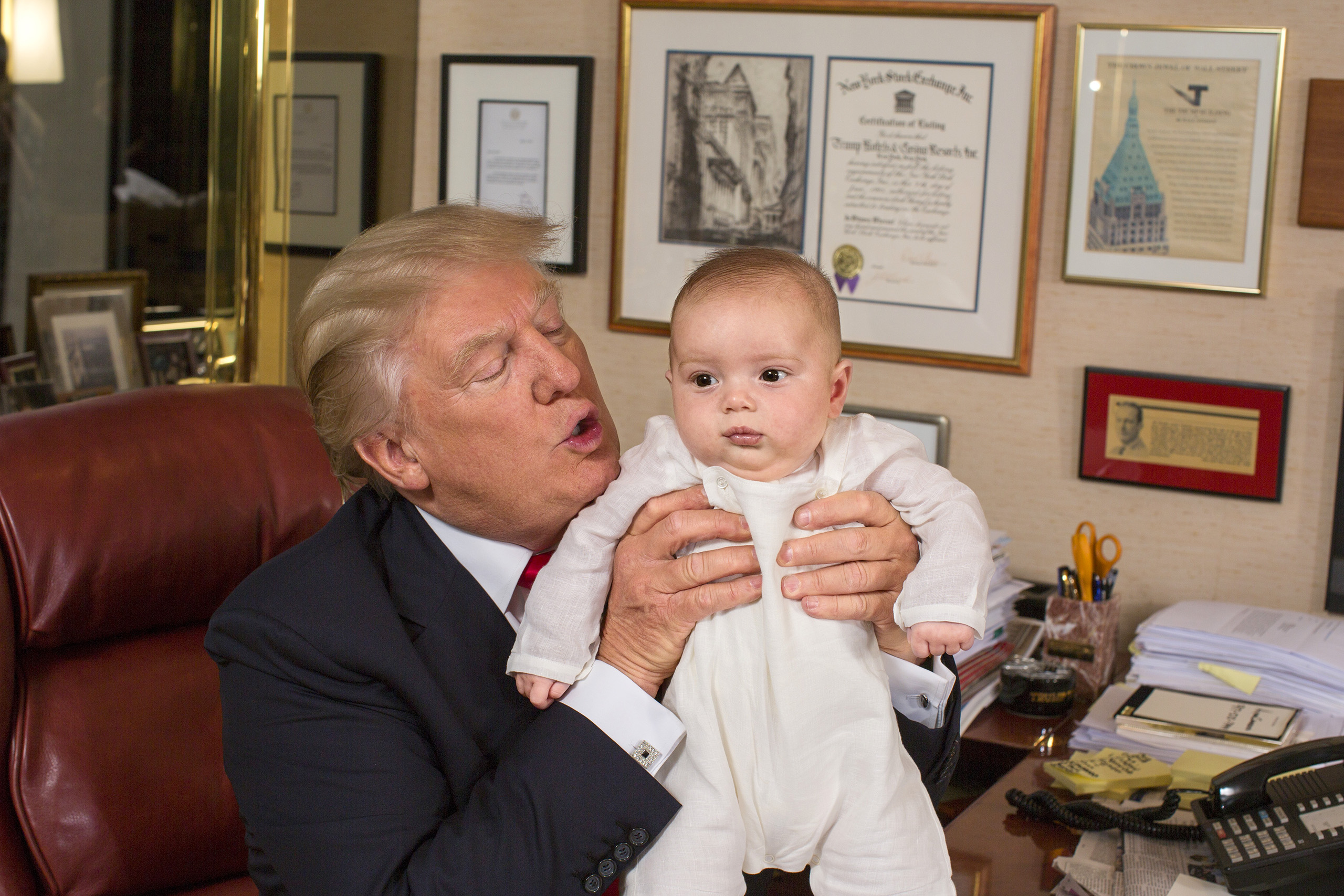 Republican presidential candidate Donald Trump with his grandson Theodore James in Trump’s office in New York City on July 11, 2016.