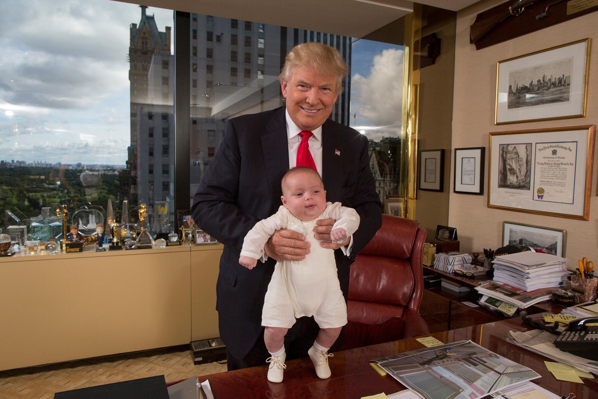 Republican presidential candidate Donald Trump with his grandson Theodore James in Trump’s office in New York City on July 11, 2016.