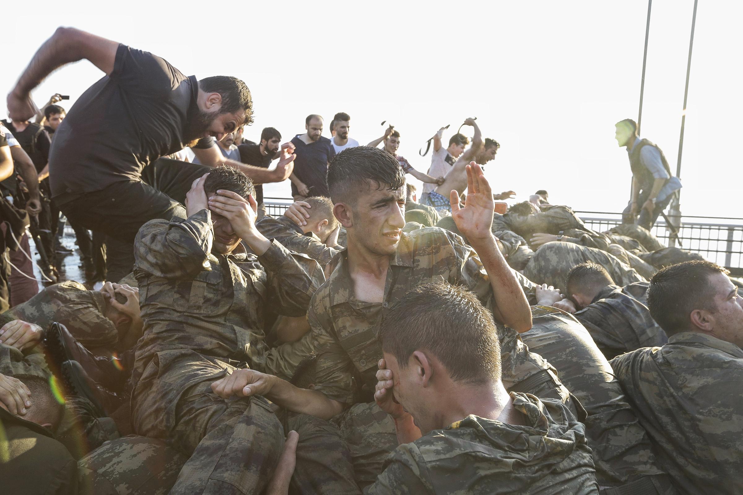 Soldiers involved in the coup attempt surrender on the Bosporus Bridge in Istanbul, Turkey, on July 16, 2016.