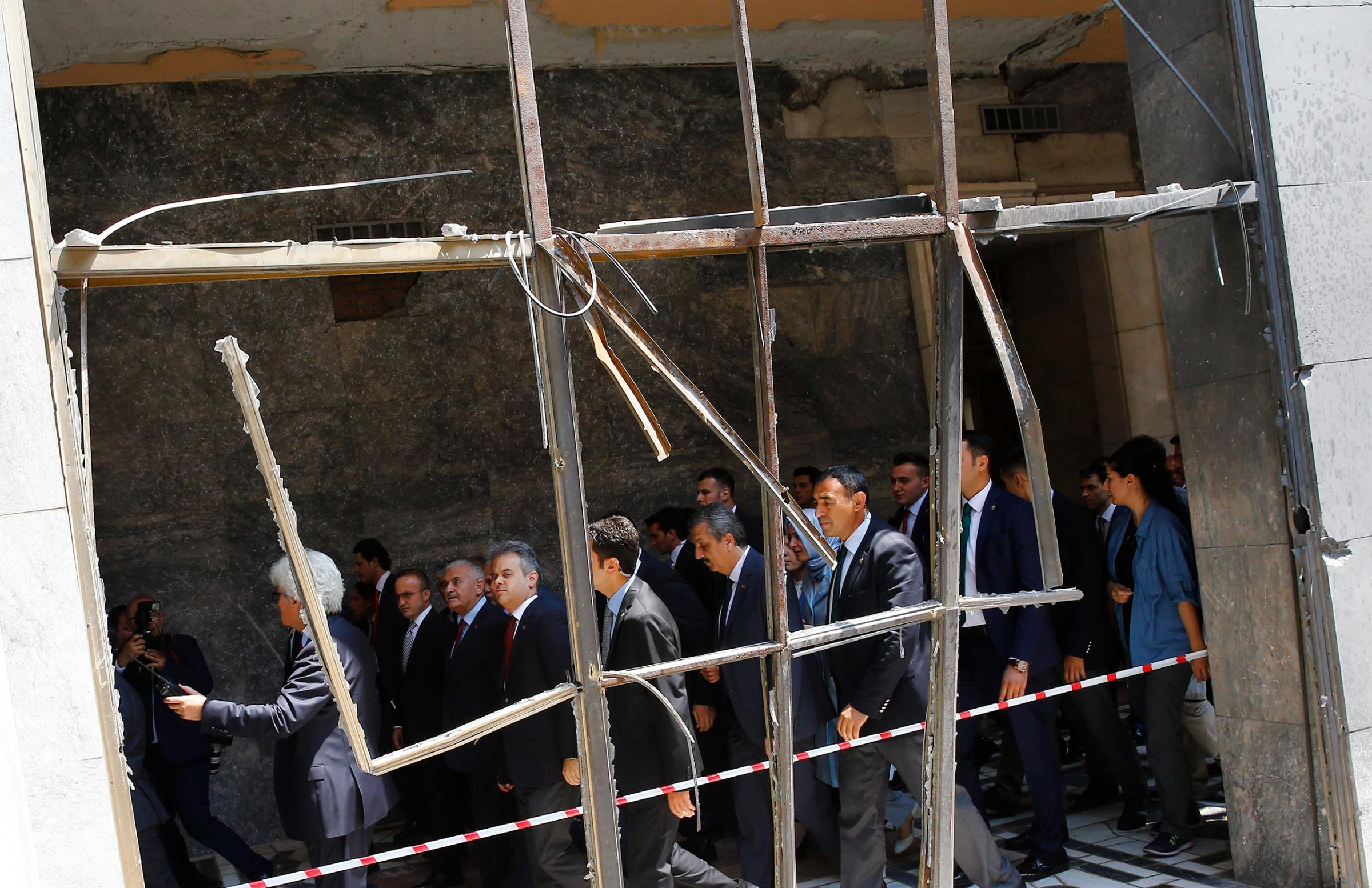 Turkey's Prime Minister Yildrim visits damaged parts of Turkish parliament in Ankara
