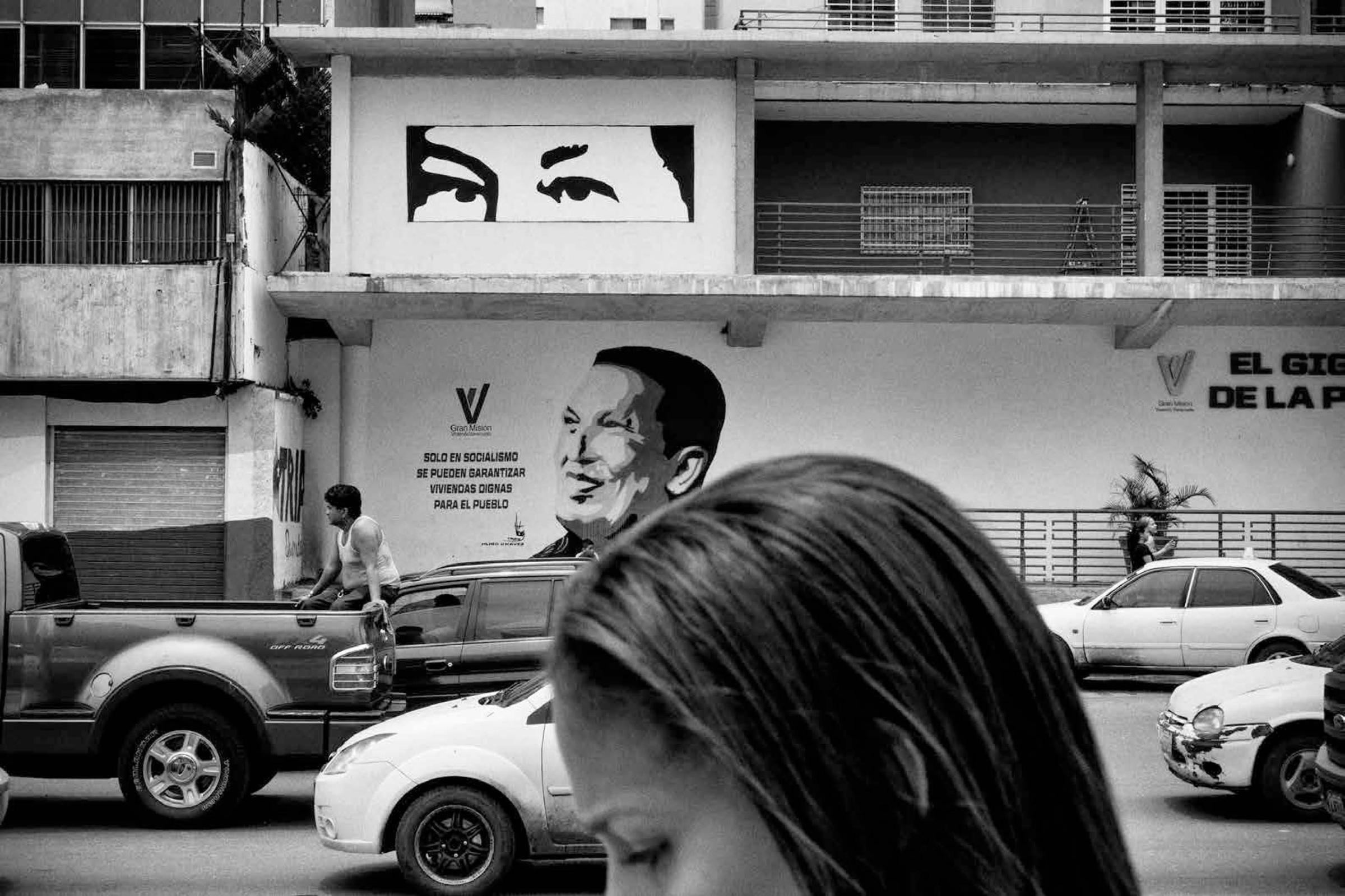 Images of former President Hugo Chavez are still pervasive around Venezuela, along with anti-imperialist and revolutionary propaganda graffiti. For the Venezuelan government, the personality cult surrounding the Bolivarian leader, helps keep the spirit of the revolution alive, Caracas, Venezuela, July 2015.