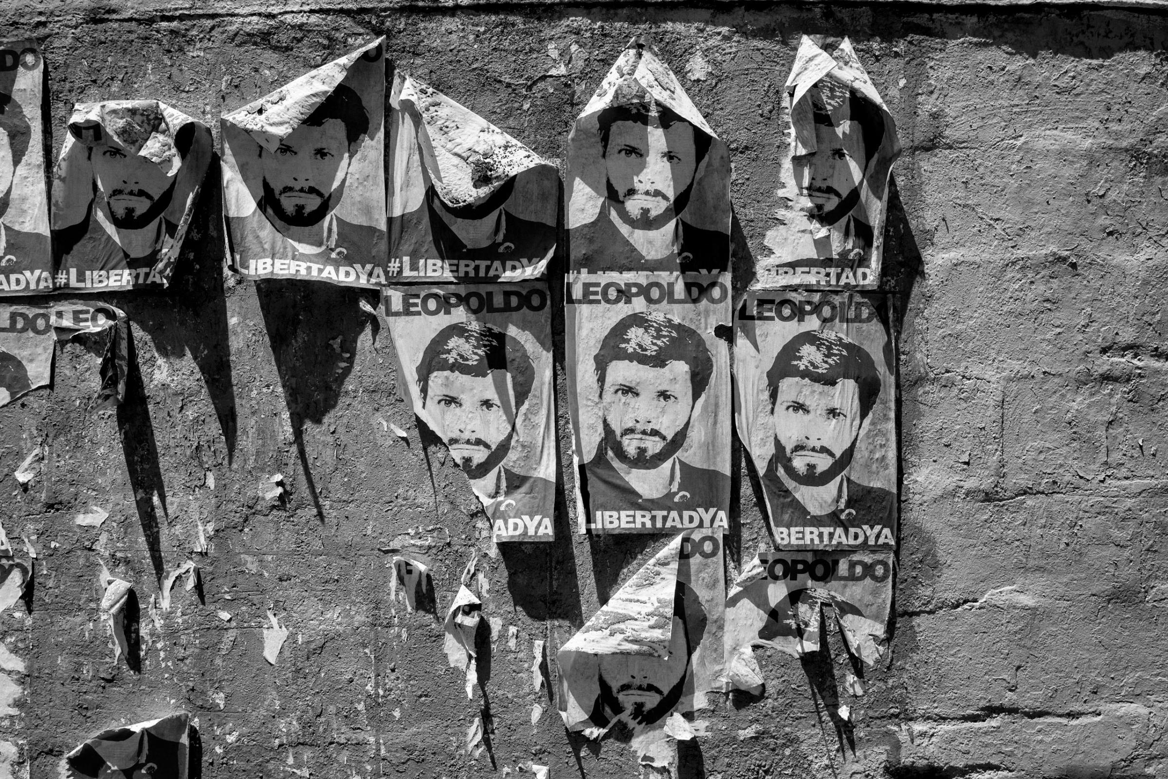 Posters of political prisoner Leopoldo Lopez hang on a wall in Caracas. The Venezuelan government of President Nicolas Maduro has been widely condemned for its treatment of the political opposition, including most notably Leopoldo Lopez, leader of the opposition, who is serving a 14-year sentence, June, 2016.