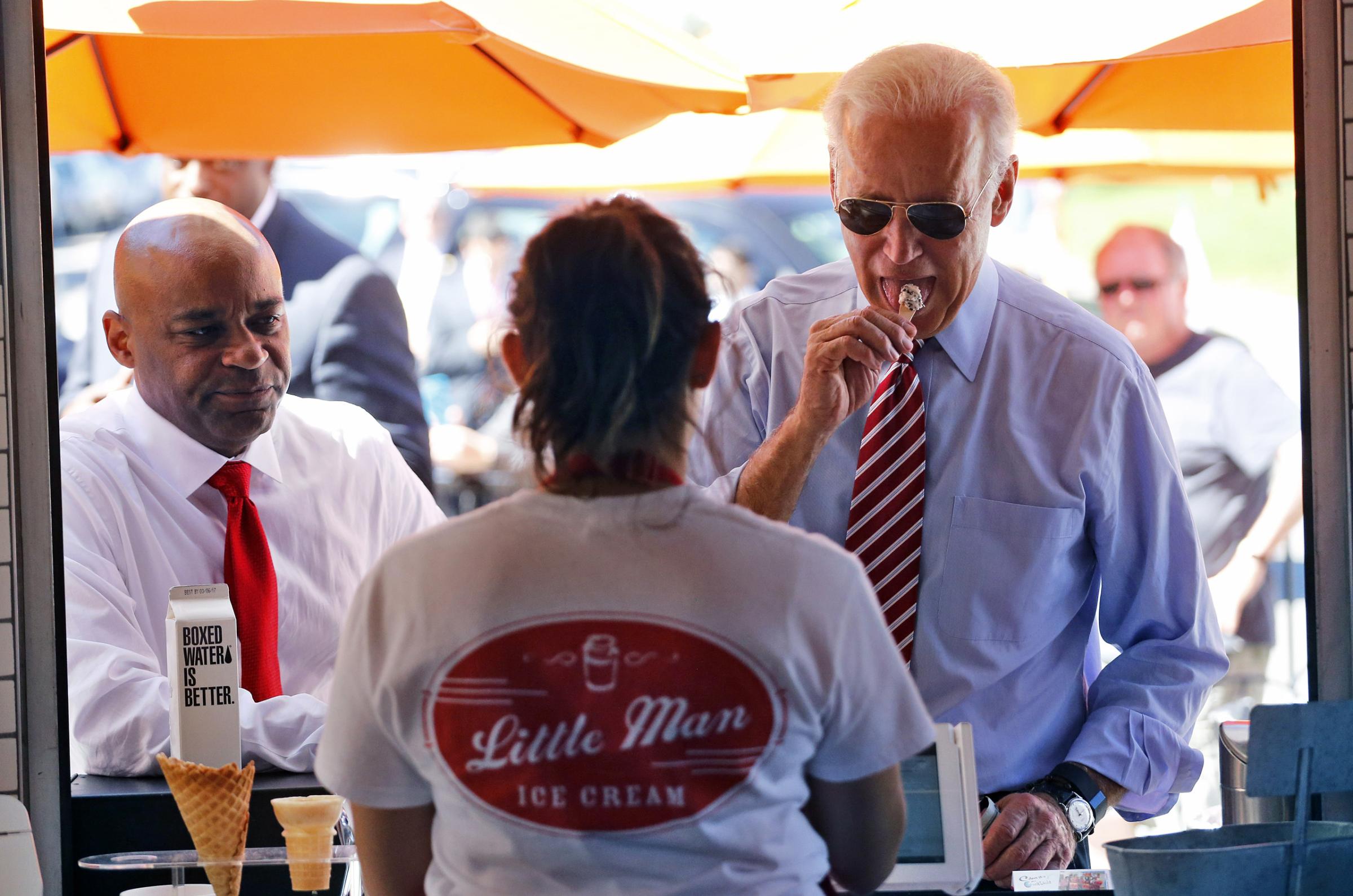 Vice President Joe Biden tastes different ice creams during a visit to Little Man Ice Cream, in Denver on July 21, 2015.