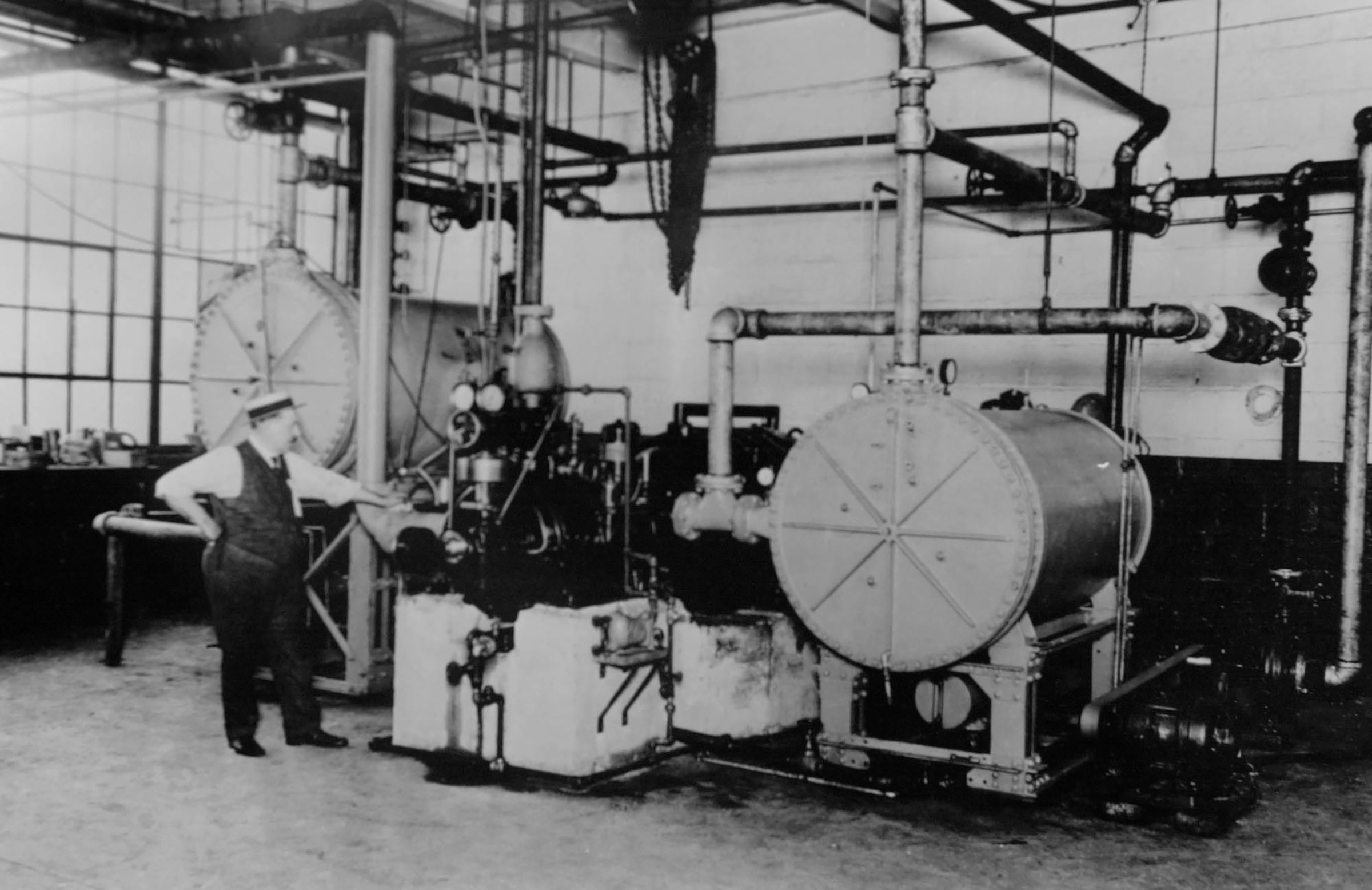 The first centrifugal refrigeration machine invented by Willis H. Carrier, the father of air conditioning, is pictured in Syracuse, New York in 1922.