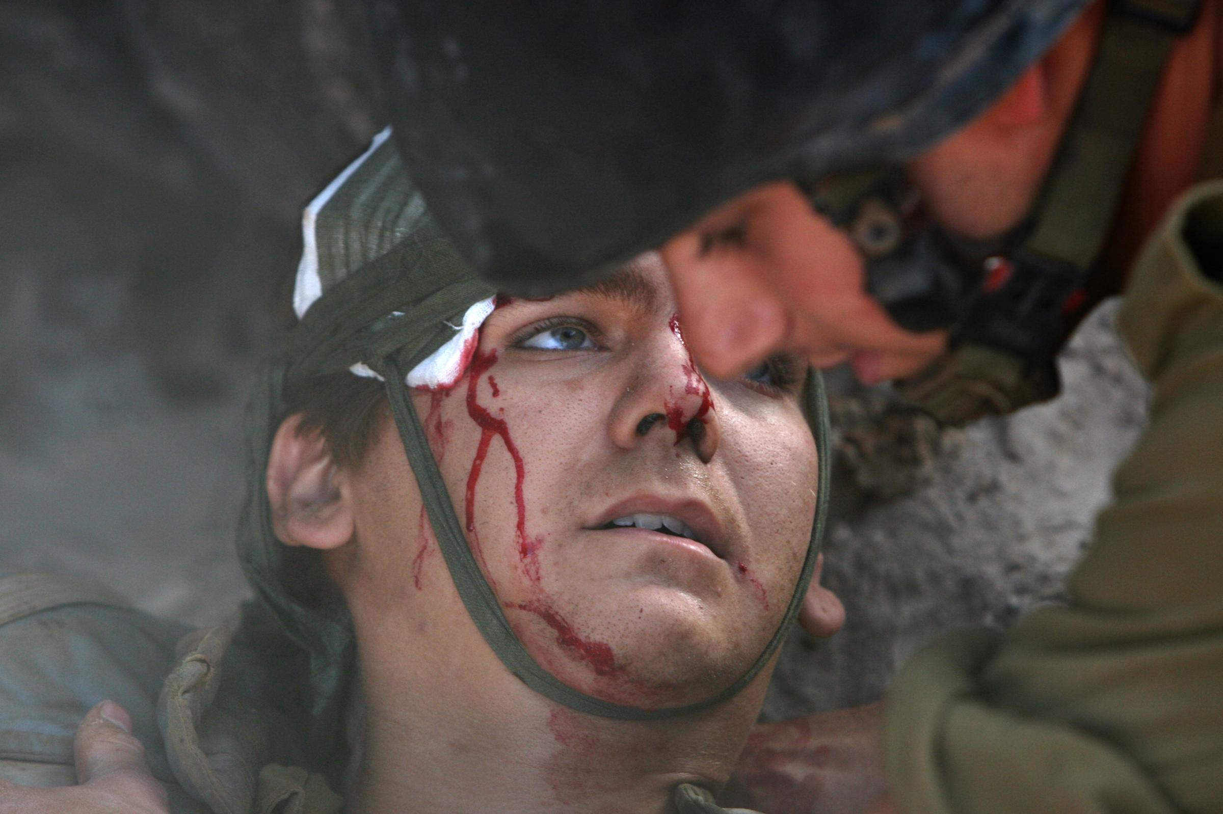 This image I took, as the only embedded photographer with the IDF, depicts a classic "sacrifice" visual narrative of a hero giving his life for his nation. I was told by several people that it was ’very Vietnam’. Since this image was not overtly gruesome and since the soldier survived his injuries, it could be prominently displayed. I later learned that this scene actually represents a victim of a friendly fire incident, though it had already circulated and had been published with the caption that this soldier had been wounded in a Hezbollah attack. Because I insisted that information be included in the caption, the image lost value as a propaganda tool. This soldier was inconveniently hit by the wrong explosives. I have come to believe that embedded ‘war photography’ simplifies the brutal ambiguity of conflict into well-worn and widely recognized visual templates. We, “war photographers,” help in reinforcing masculine myths of war as a purging experience. As it stands, I believe my images did a great disservice to the people who died or participated in this unnecessary and farcical demonstration of force in 2006, which besides claiming the lives of more than one hundred Israeli soldiers, also killed almost 30 times more Lebanese civilians than the 44 Israeli civilian dead. This conditioned Israeli public opinion to accept similar carnage in Gaza in 2009 and 2014 as a reasonable response.