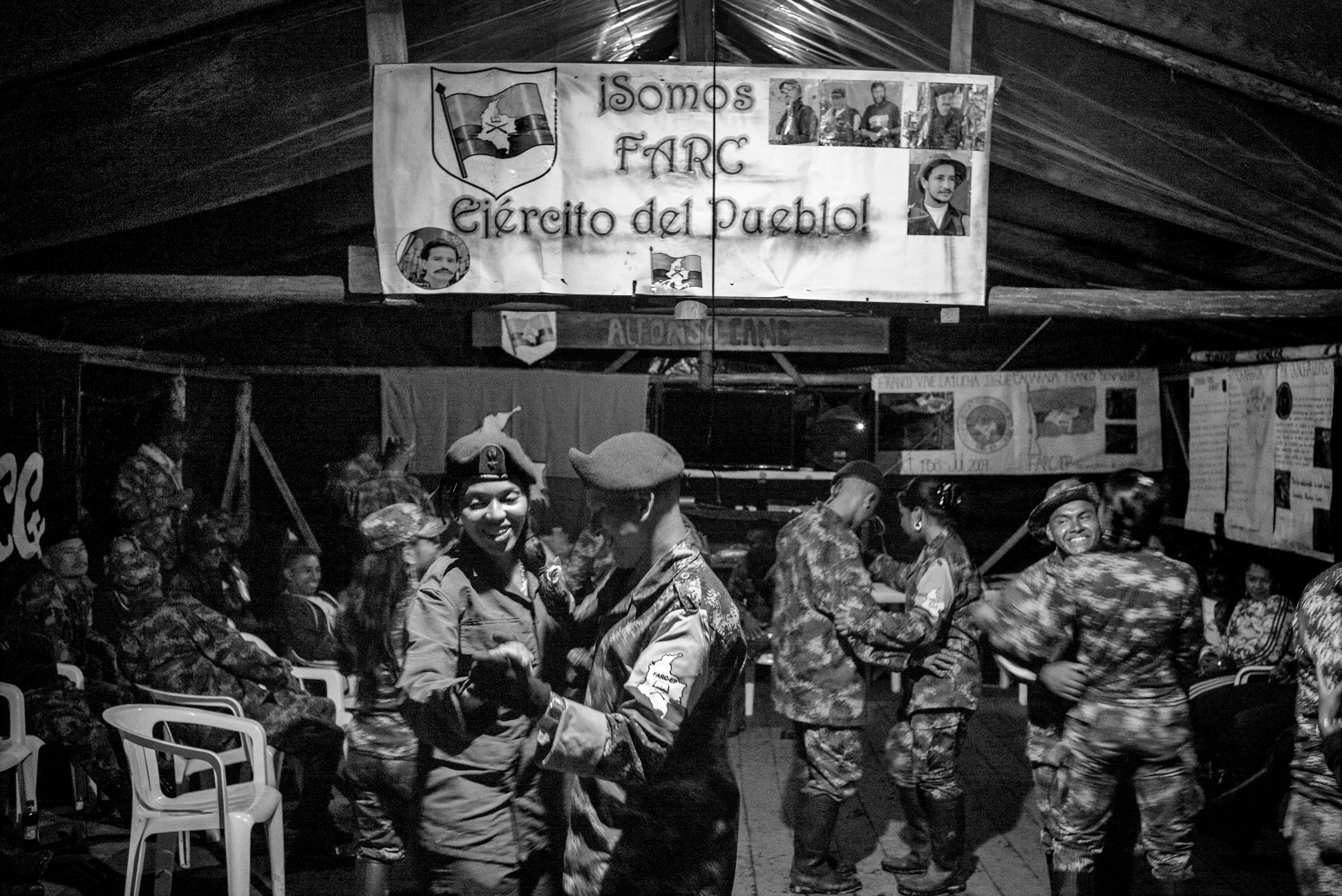 Revolutionary Armed Forces of Colombia (FARC) guerrilla members dance during a party at a camp. For fity-two years, FARC has been an armed movement in Colombia. With the peace agreements reached in Havana on August 24, 2016, it will begin to move towards becoming a political movement, Cauca, Colombia, July 2016.