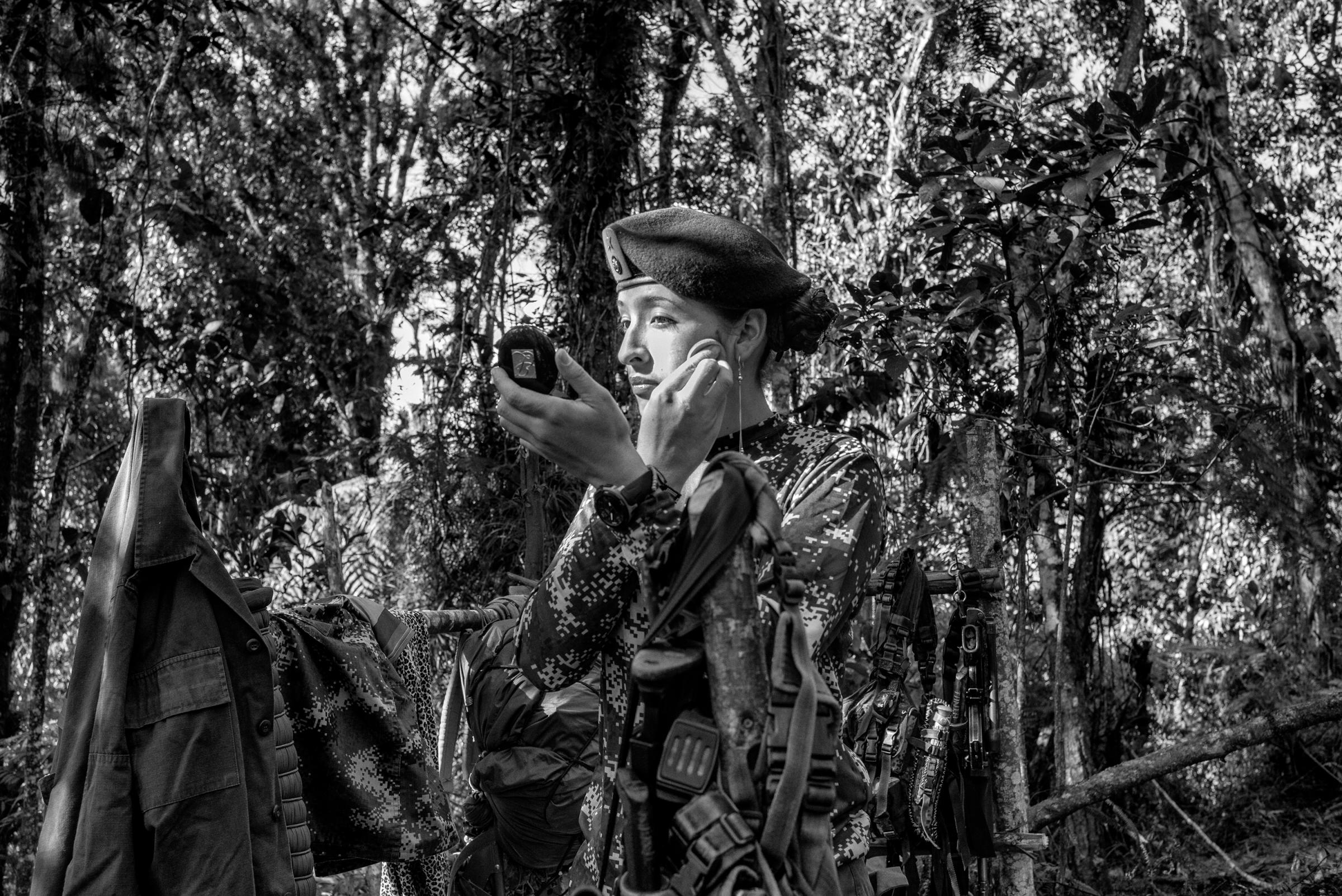 Tania, A FARC guerrilla member, puts on makeup at a camp, Cauca, Colombia. On Oct. 2, 2016, Colombians will vote in a referendum to end Colombia's 52-year old conflict between FARC, the military and right-wing paramilitaries, July 2016.