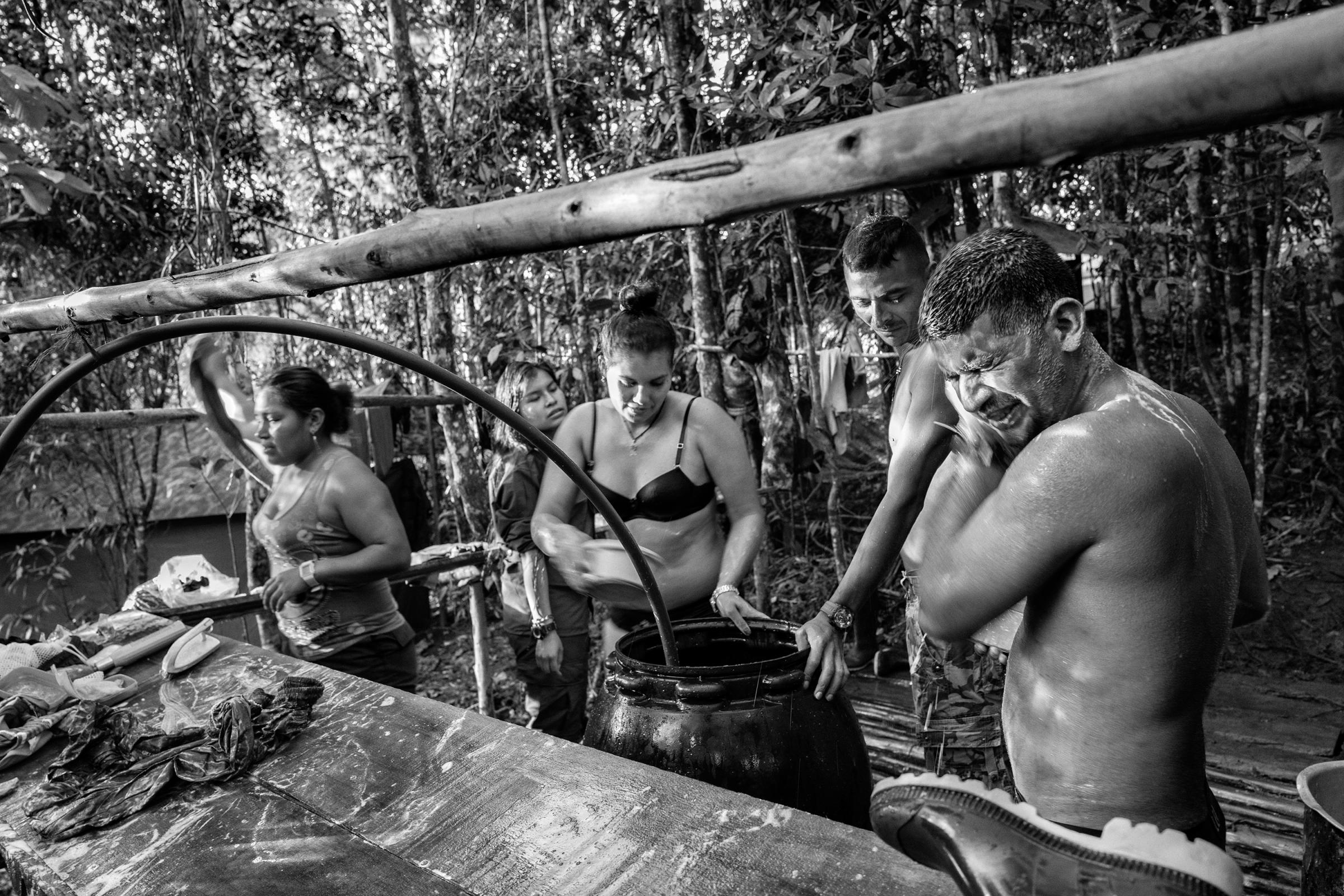 FARC guerrilla members shower at a camp, Cauca, Colombia, July 2016.