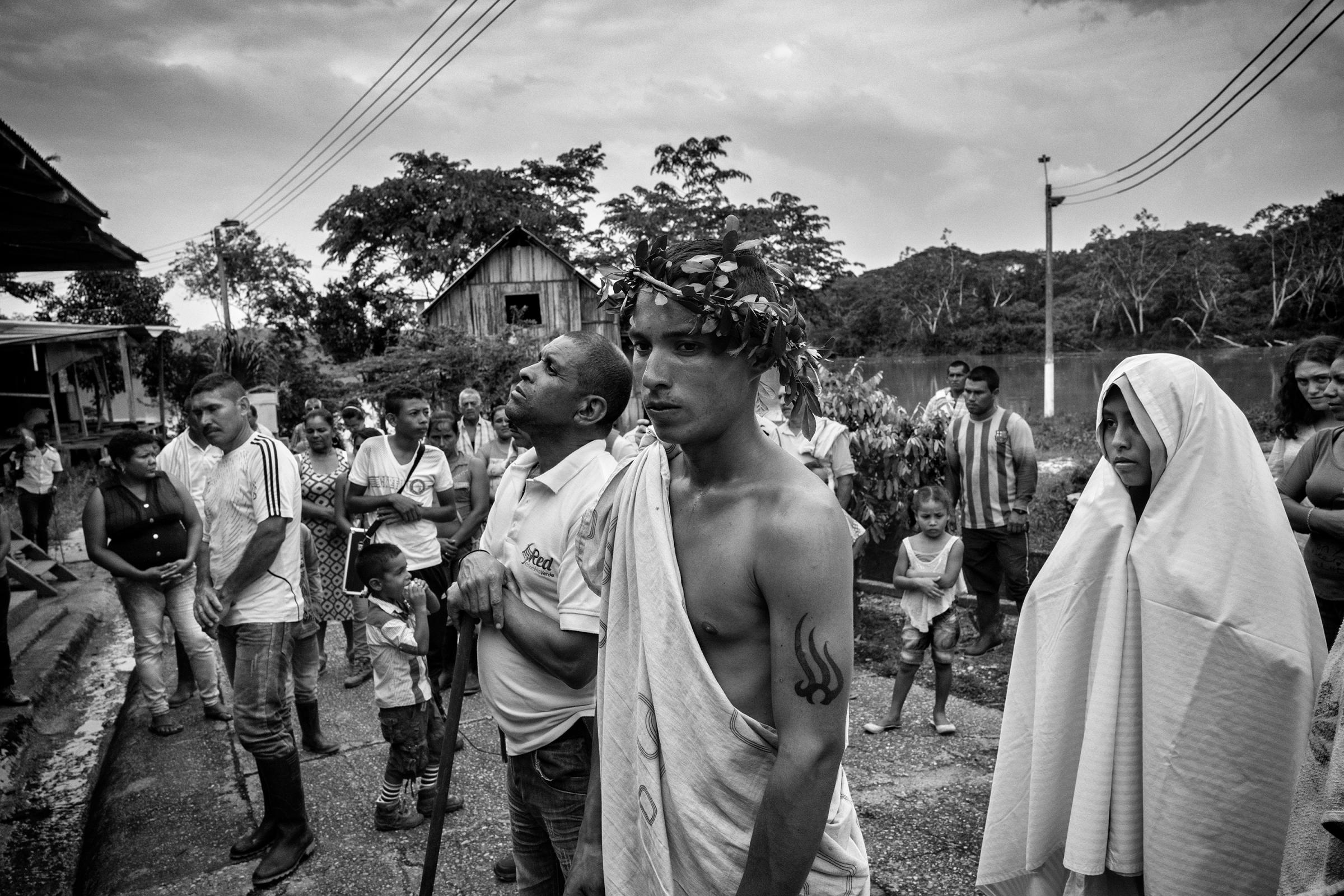 A group of local civilians attend Easter celebrations in the community of Puerto Camelias del Caguan, Caqueta, Colombia, April, 2016.