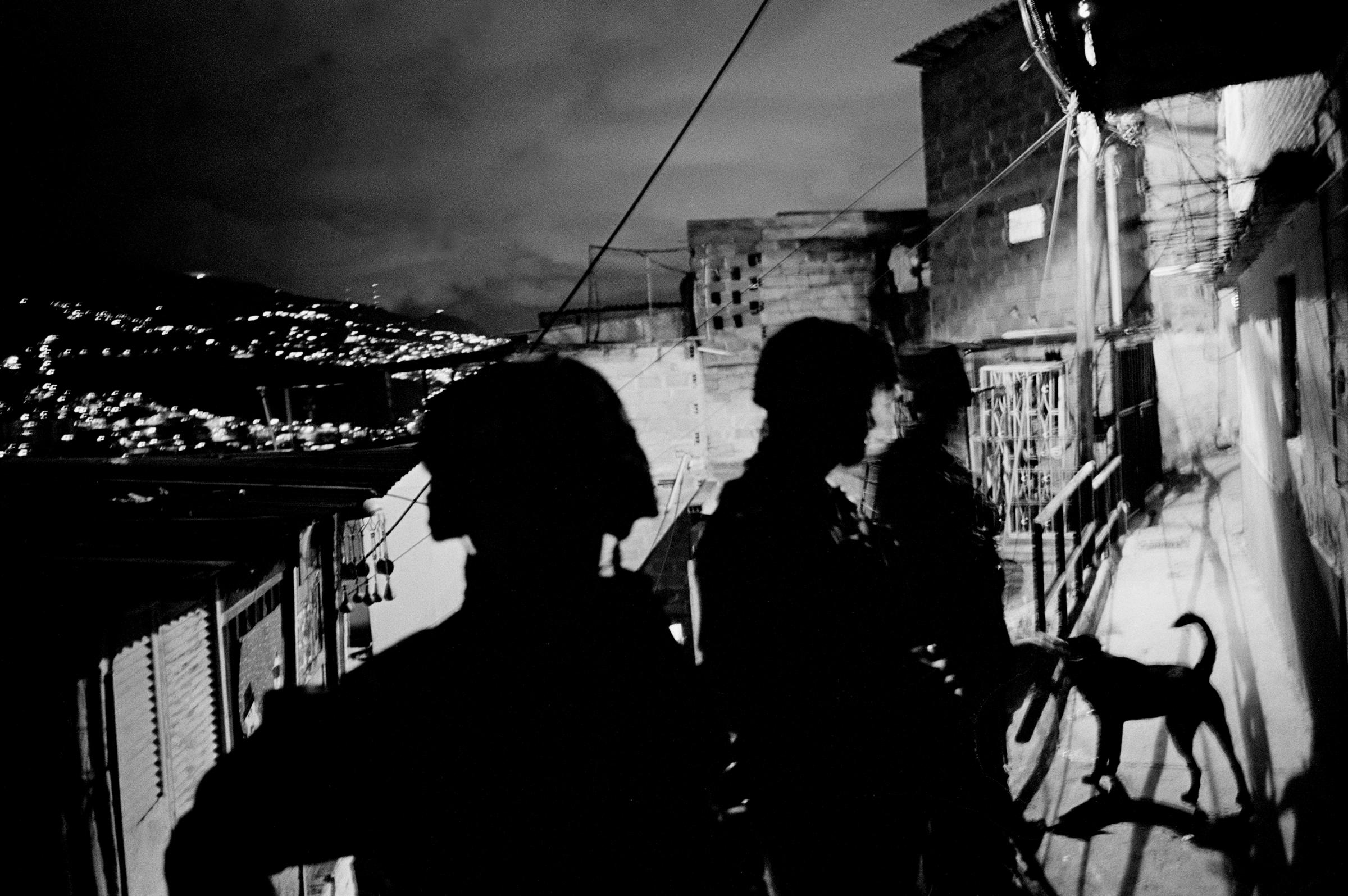 A group of soldiers patrol the streets of "La comuna" number 13, a neighborhood with many FARC militants, and a stronghold for the distribution of cocaine, Medellin, Colombia, 2011.