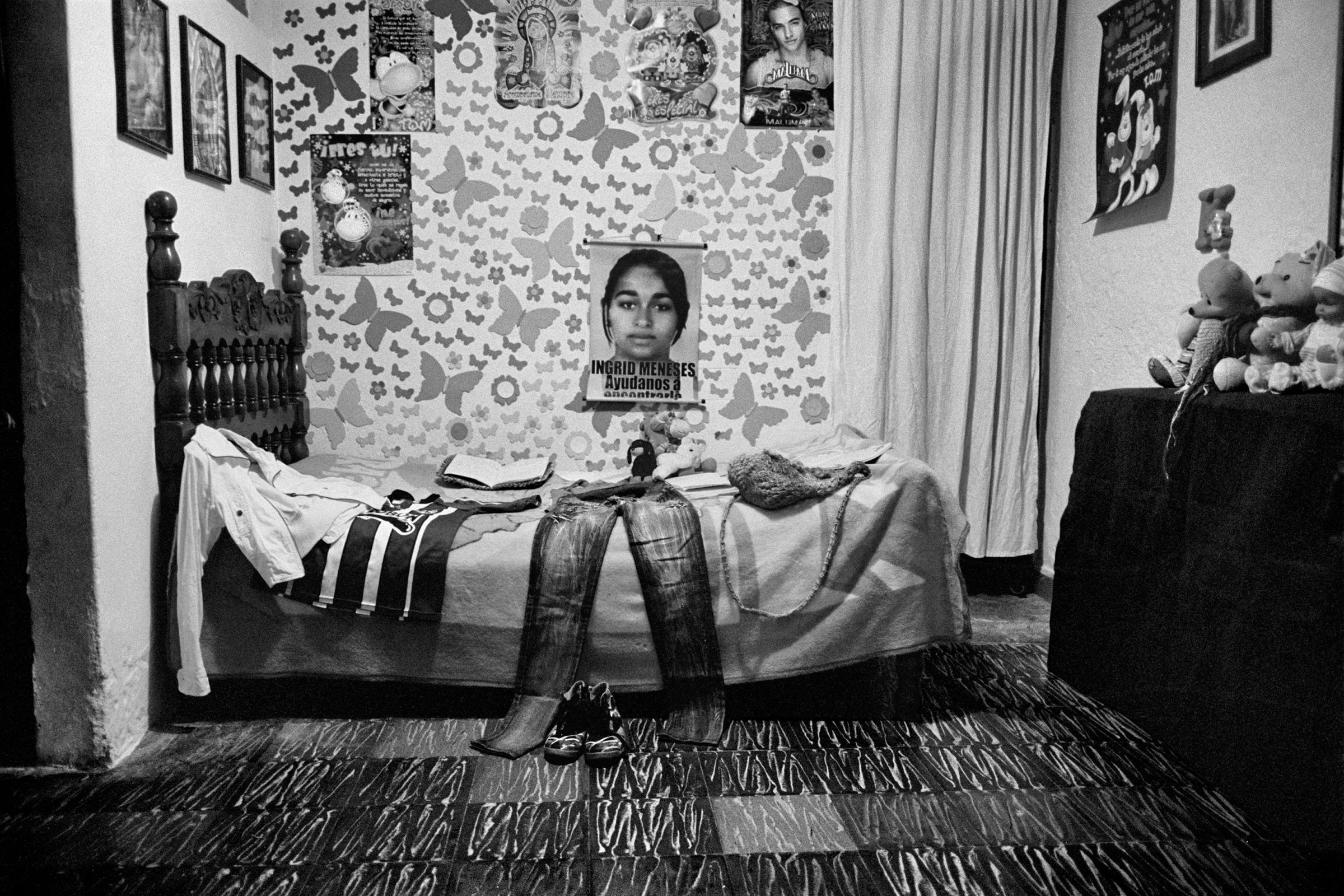 The bed of Ingrid Medarno Perez who disappeared in Yarumal, Colombia has become a shrine inside the family home of Martha and Antonio, Ingrid's parents. At eleven in the morning on Nov. 29, 2010, a member of the paramilitary group of the Urabeños went to her home, where she was with her boyfriend. It was not until March 2015, that Julian Bolivar, a former paramilitary commander informed the family that Ingrid and her boyfriend were executed that same day. Their bodies were crushed and thrown into the river. Their remains were never recovered, Feb. 2015.