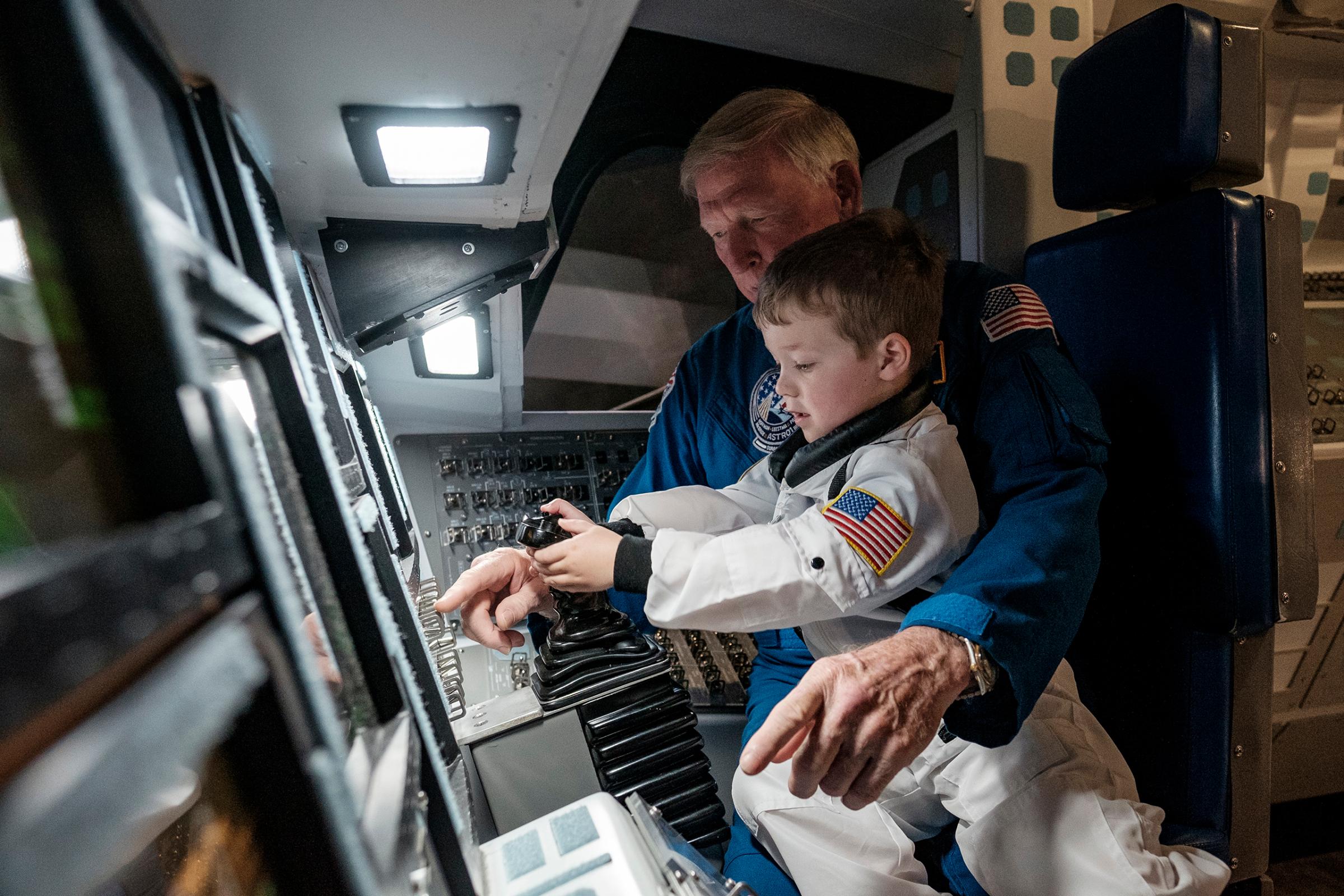 Harrison receives flight instruction from Buzz Aldrin, July 20, 2016.