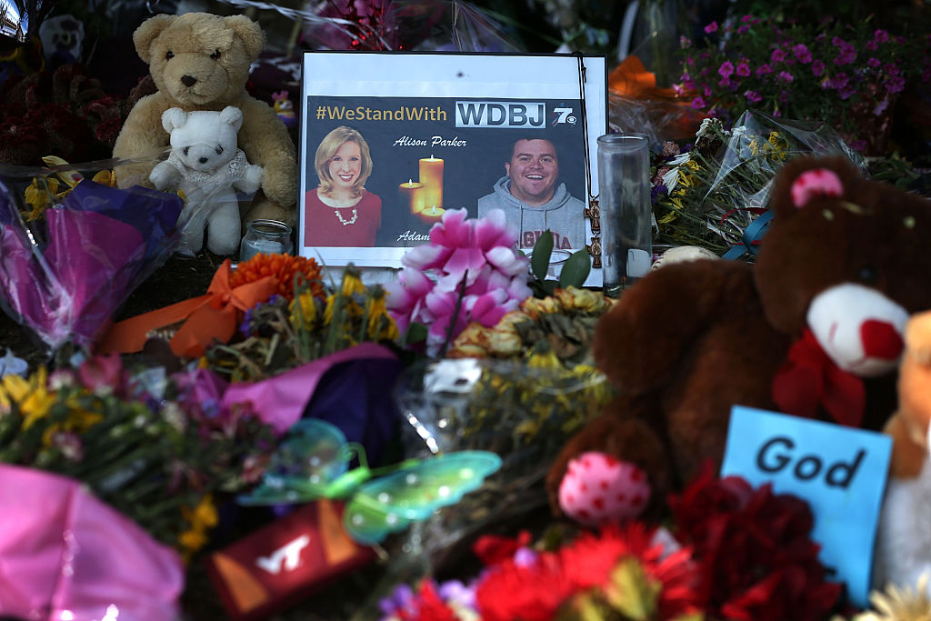 A picture of slain WDBJ photojournalists Adam Ward and Alison Parker is seen at a makeshift memorial outside the station September 1, 2015 in Roanoke, Virginia.