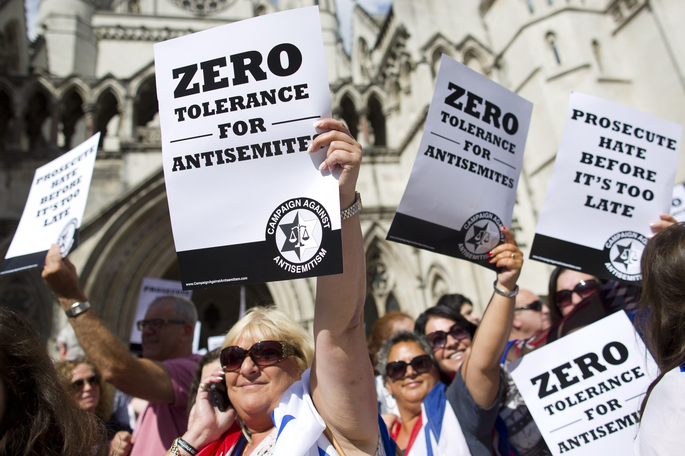 Jewish groups protest outside the Royal Courts of Justice in London on August 31, 2014, as they call for "Zero Tolerance for Anti-Semitism". Jewish groups demonstrated outside the British High Court as latest figures published by the Community Security Trust reported a spike in anti-semitic attacks on people and property in the UK following the lastest outbreak of violence between Israel and Palestinians in Gaza.