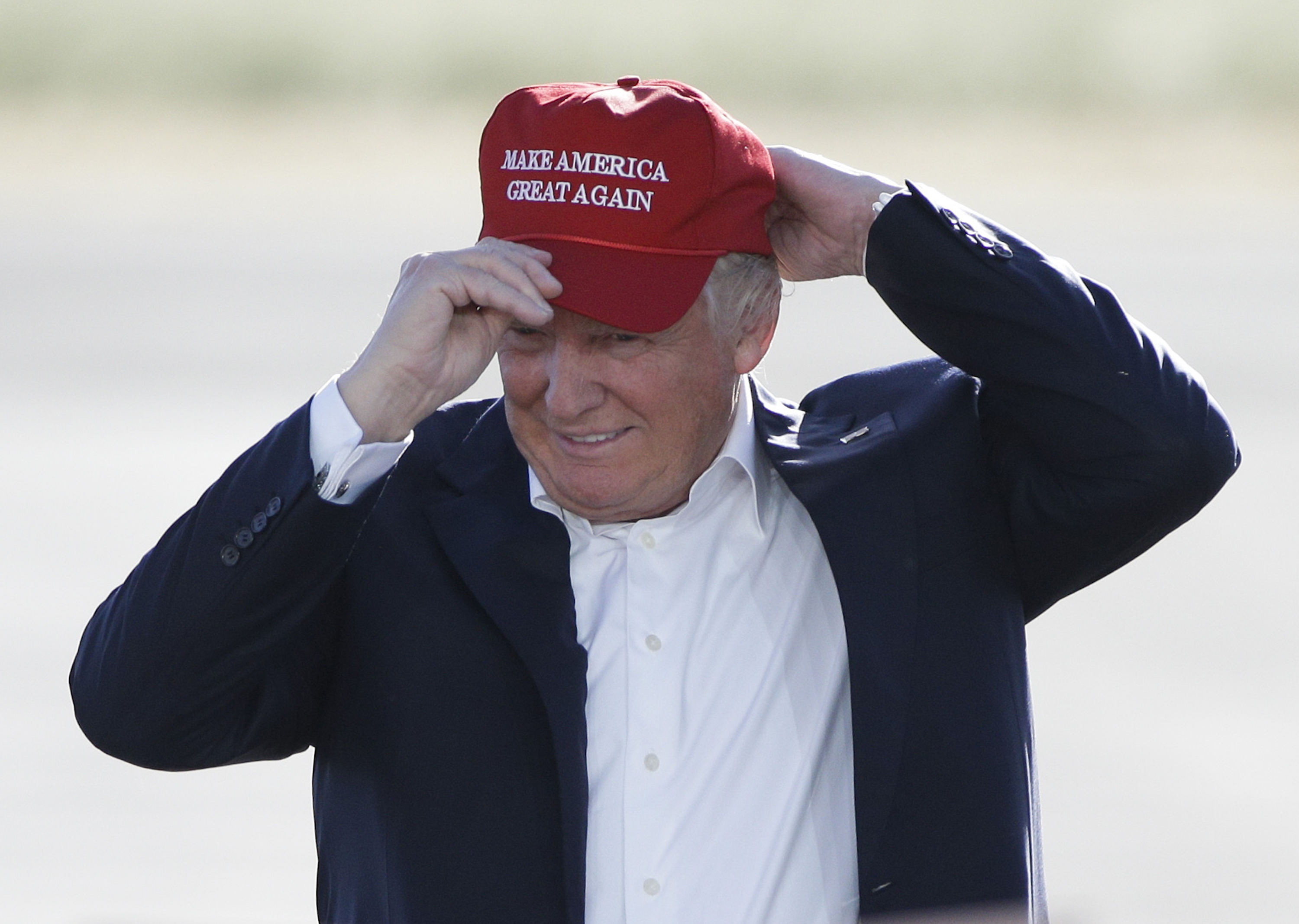 In this June 1, 2016, file photo, Republican presidential candidate Donald Trump wears his "Make America Great Again" hat at a rally in Sacramento, Calif. (Jae C. Hong—AP)