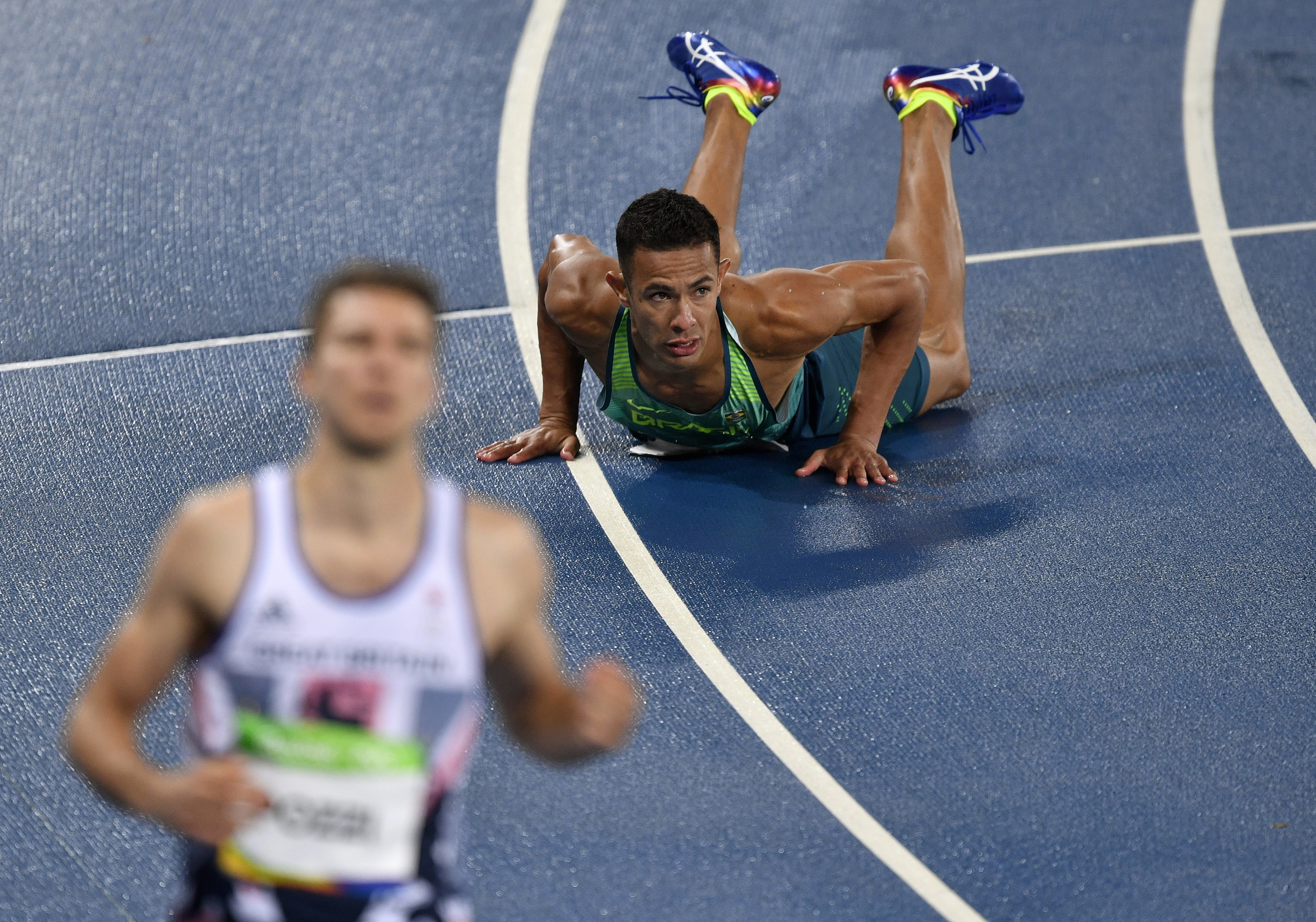 Britain's Andrew Pozzi and Brazil's Joao Vitor De Oliveira, right, compete in a men's 110-meter hurdles heat during the athletics competitions of the 2016 Summer Olympics at the Olympic stadium in Rio de Janeiro, Brazil, Monday, Aug. 15, 2016. (AP Photo/Martin Meissner) (Martin Meissner—AP)