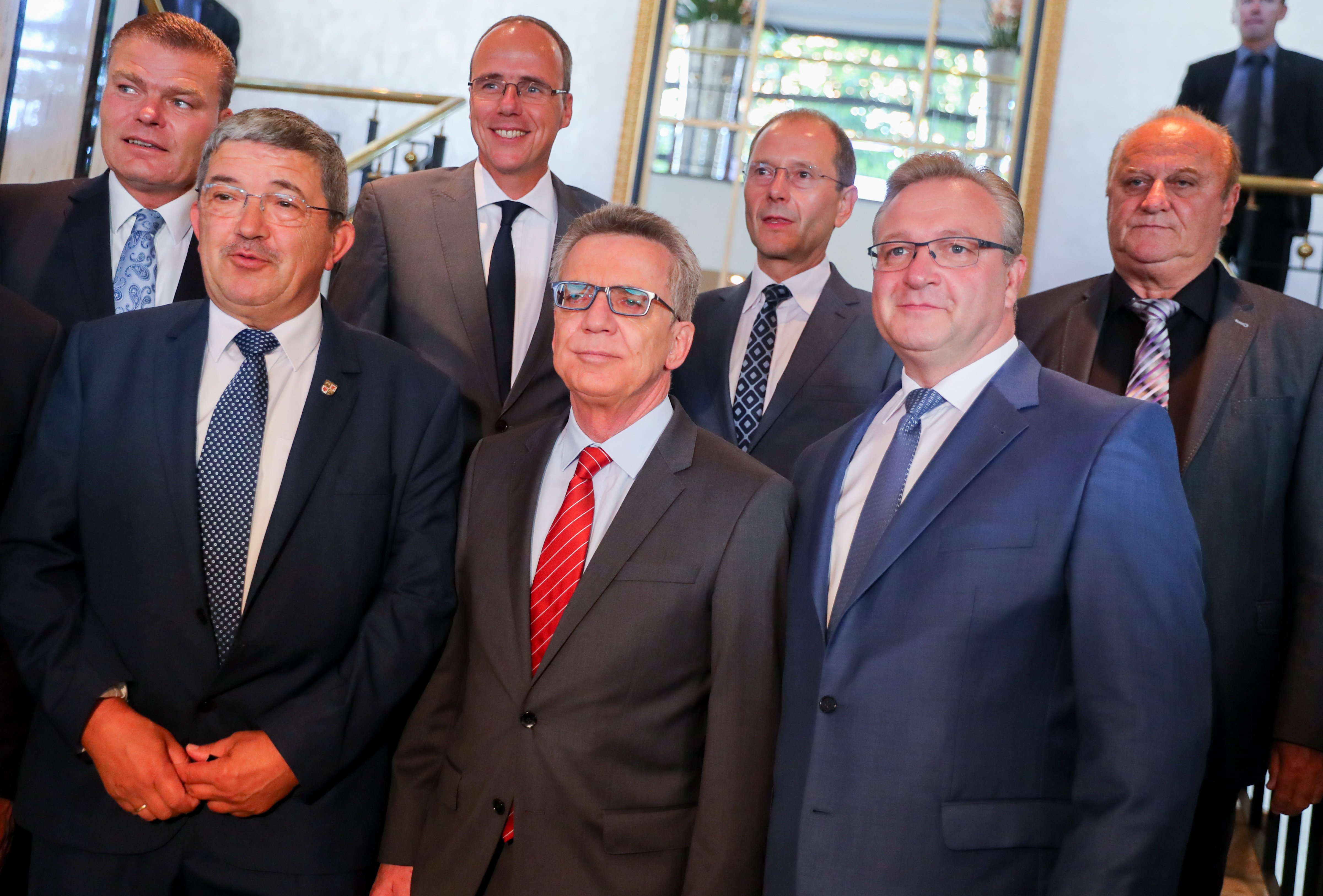 German Interior Minister Thomas de Maiziere (CDU, 3.f.r.) pictured next to his interior minister colleagues. Topics of discussion include a burqa ban and dual citizenship (Kay Nietfeld—Kay Nietfeld/picture-alliance/dpa/AP Images)