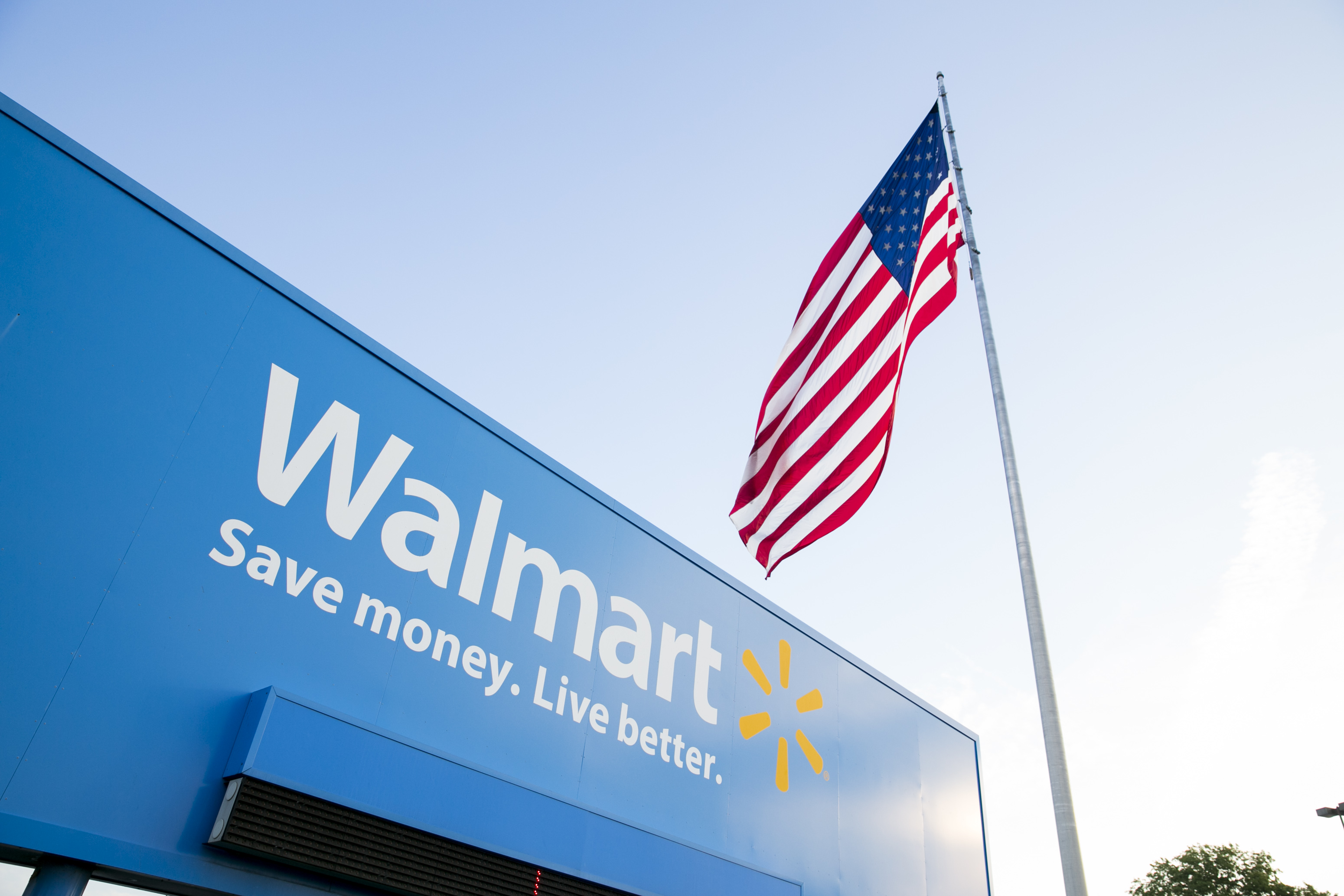 A logo sign outside of the Walmart headquarters, known as the Home Office, in Bentonville, Arkansas on August 18, 2015. (Kris Tripplaar/Sipa USA)
