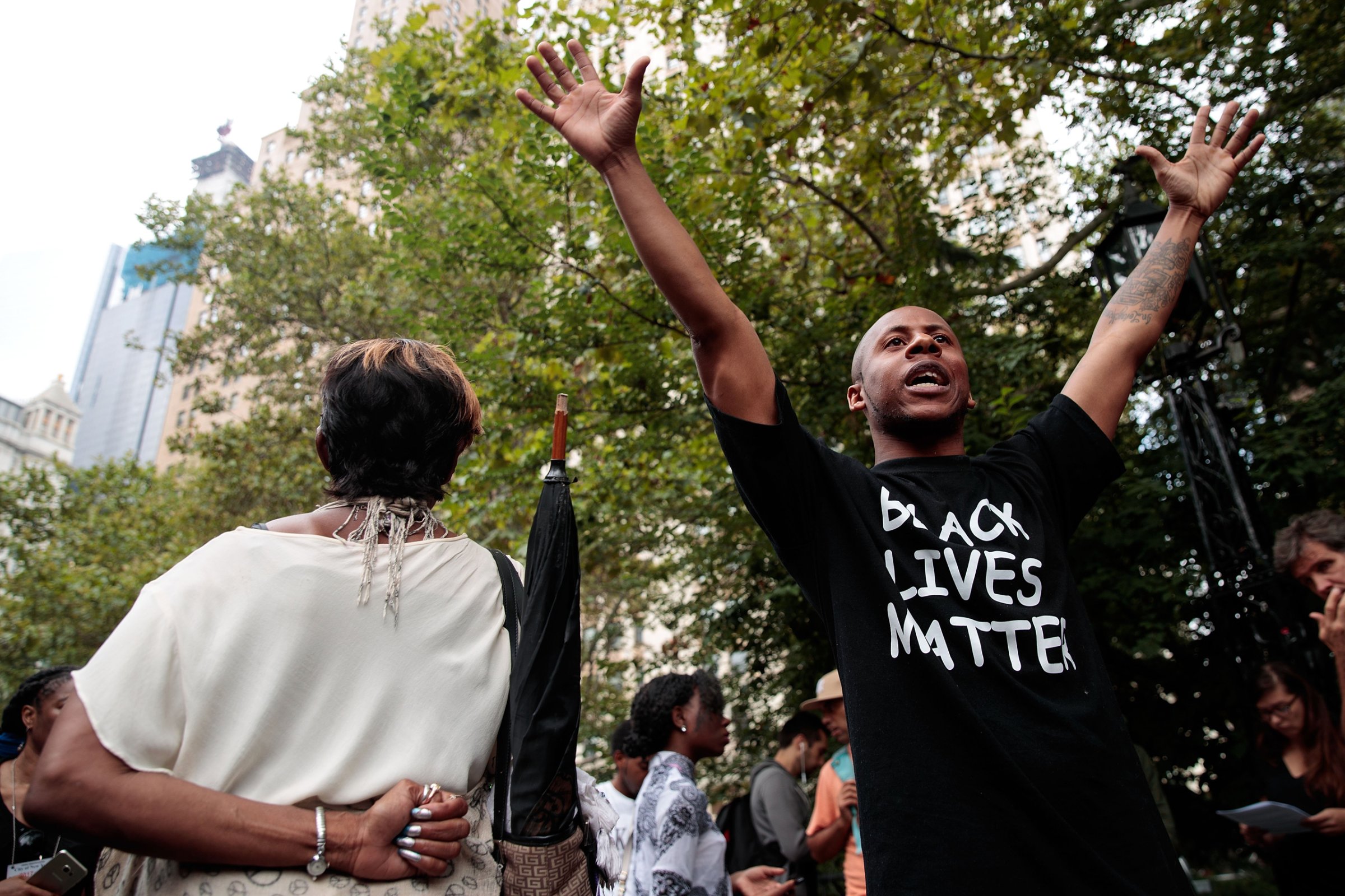 Protestors rally during a protest against police brutality at City Hall Park in New York City on Aug. 1, 2016.