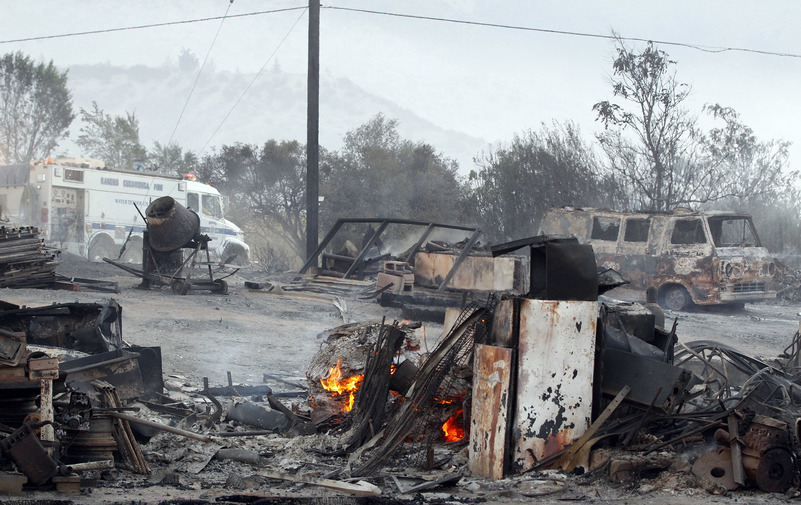 Burned property at Hess Road and Highway 138 shows the devastation of the Blue Cut fire in West Cajon Valley, Calif., Aug. 17, 2016.