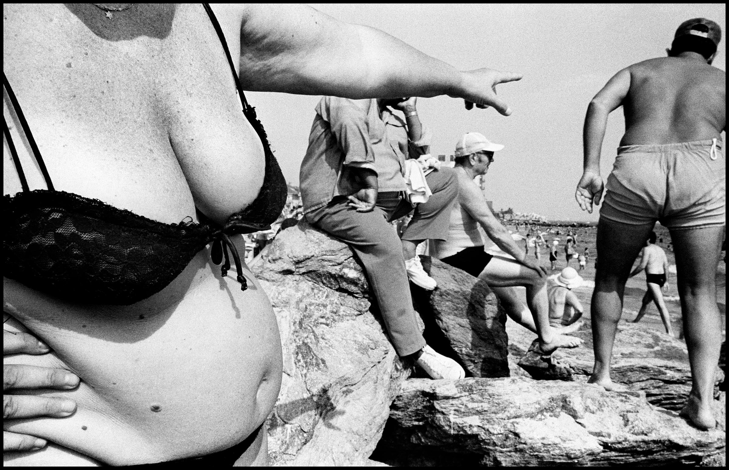 USA. NYC. Coney Island. 1982. Woman on beach pointing at a man near her."The reason is simple—I do long personal essays that are self-assigned."