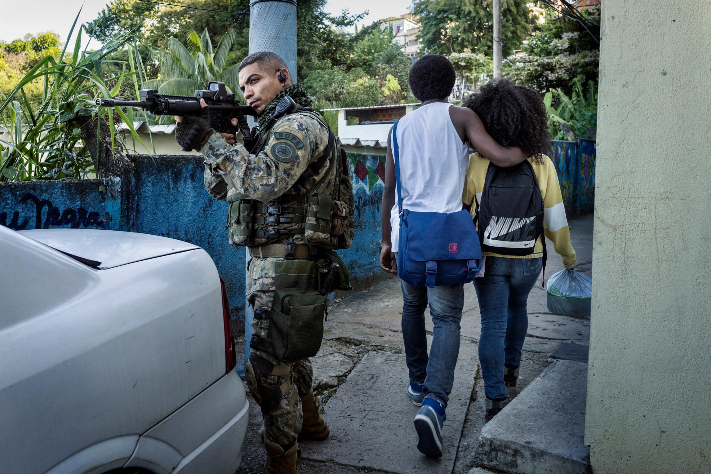 Corporal Cruz of BOPE (Battalion of Special Police Operations) during an exercise in a densely populated urban area in the Tavares favela in Rio de Janeiro.