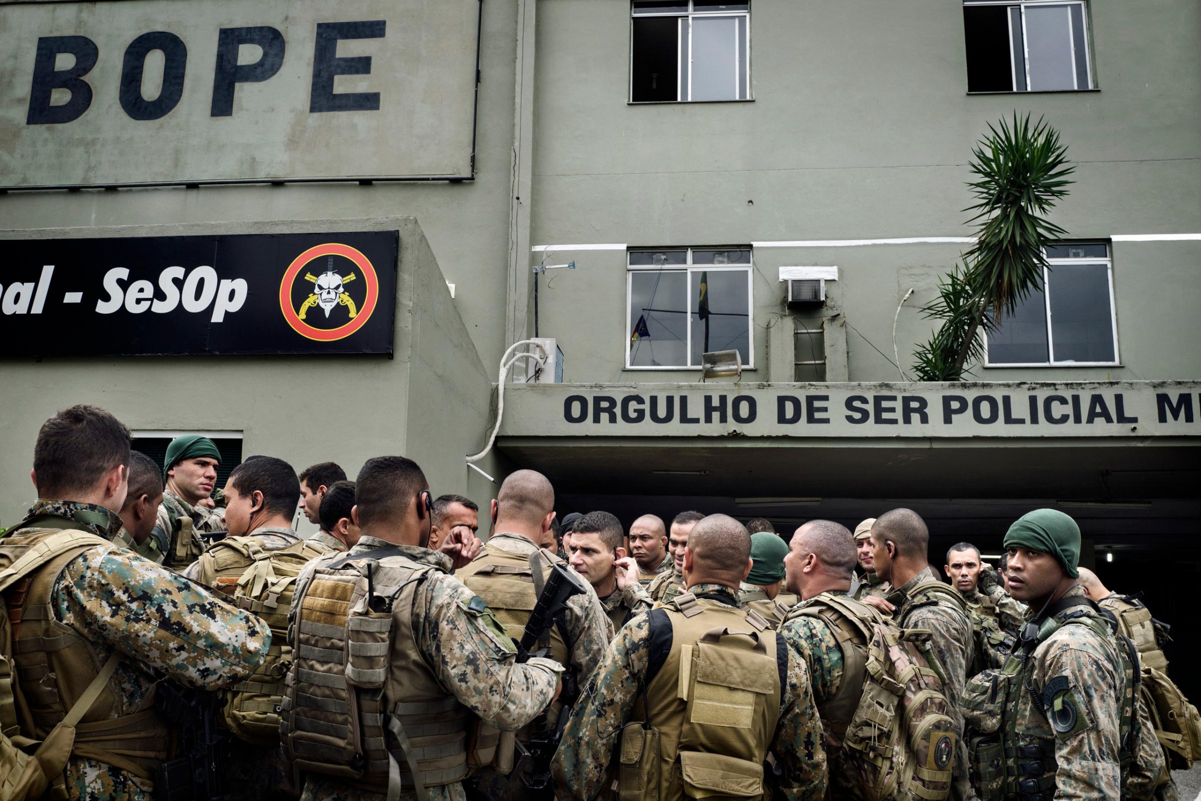 Members of BOPE (Battallion of Special Police Operations) attend a final briefing before going on an operation in one of the favelas of Rio de Janeiro.