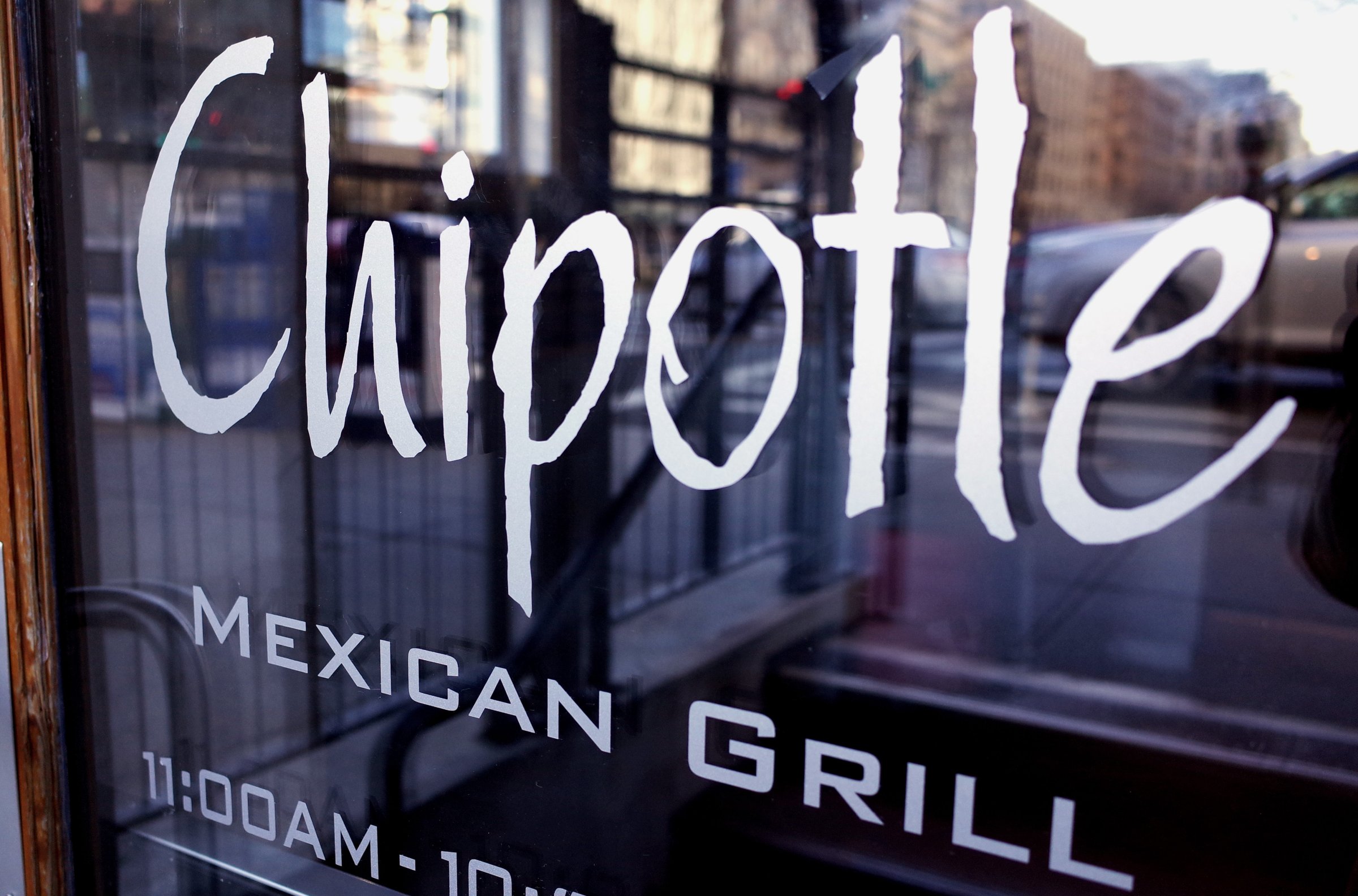 The Chipotle logo is seen on the door of one of its restaurants on January 11, 2015 in Washington, DC.